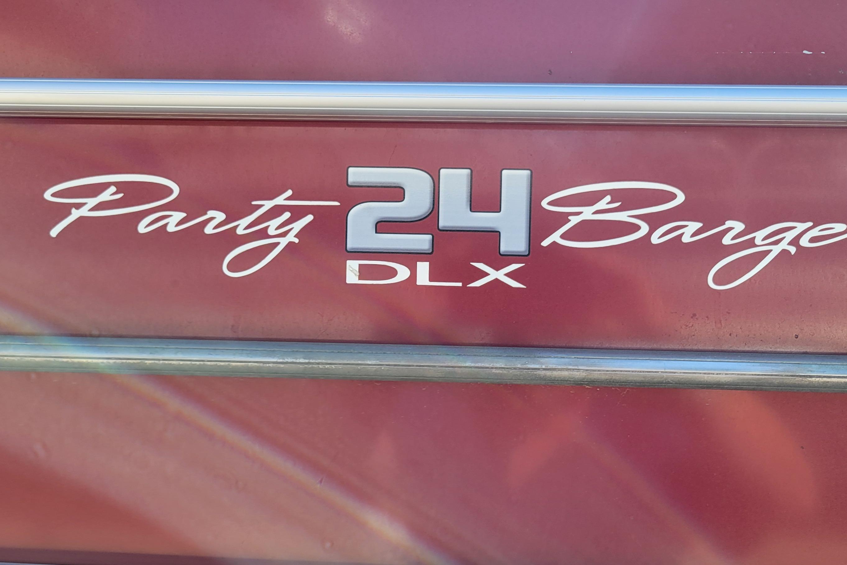 2019 Sun Tracker Party Barge 24 DLX logo on maroon background.