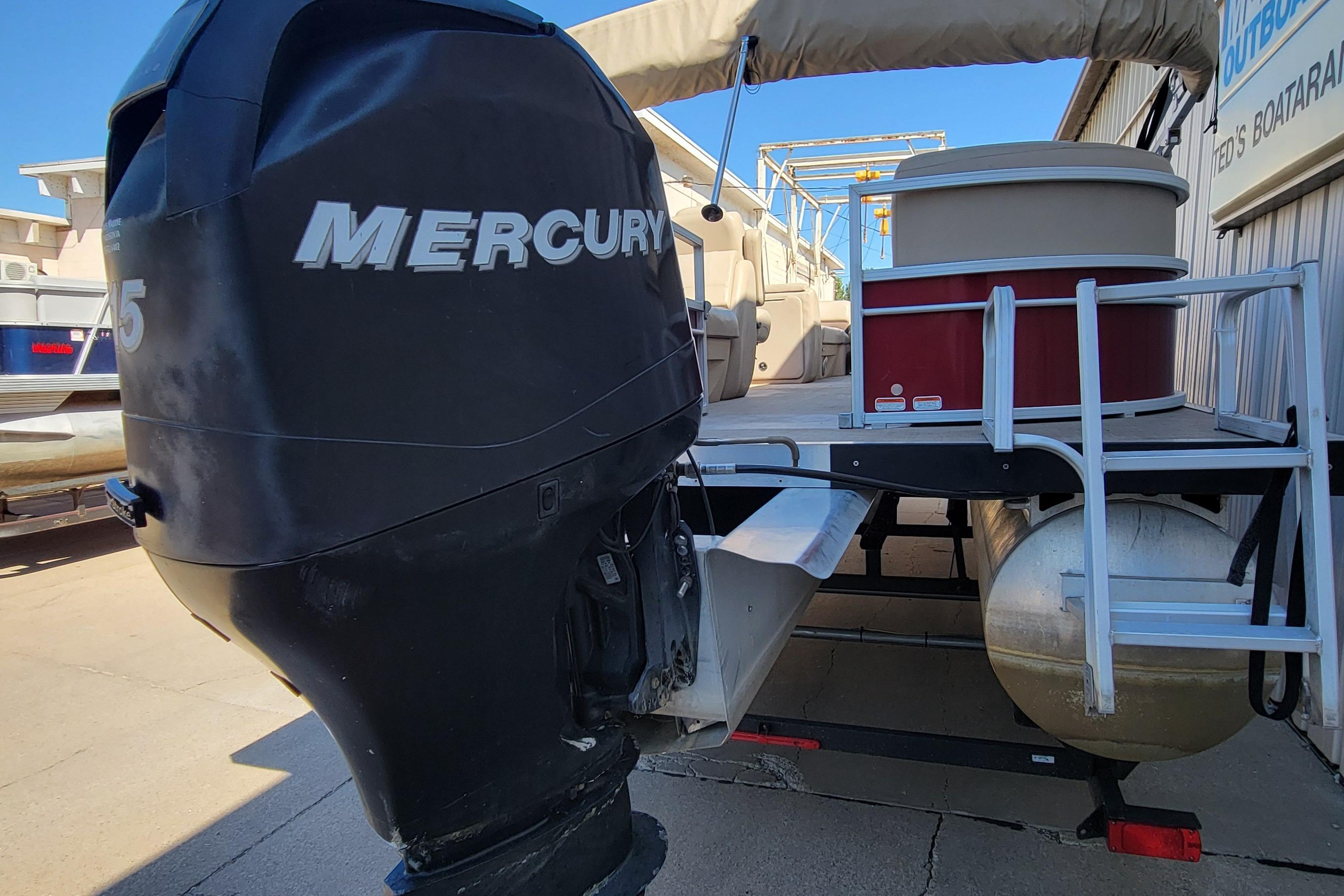 2019 Sun Tracker Party Barge 24 DLX with Mercury outboard motor.