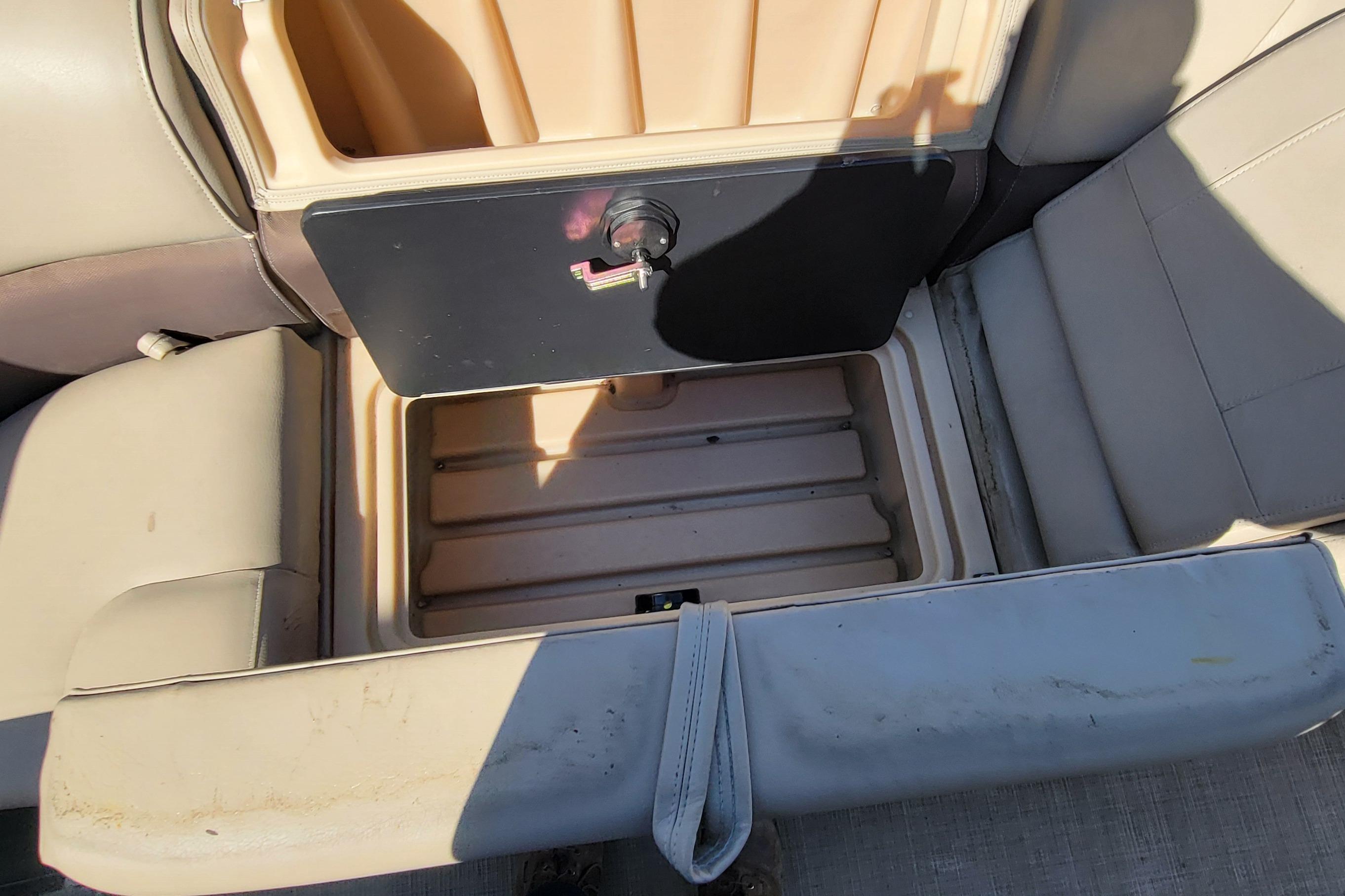 Open storage compartment on 2019 Sun Tracker Party Barge 24 DLX boat seat.