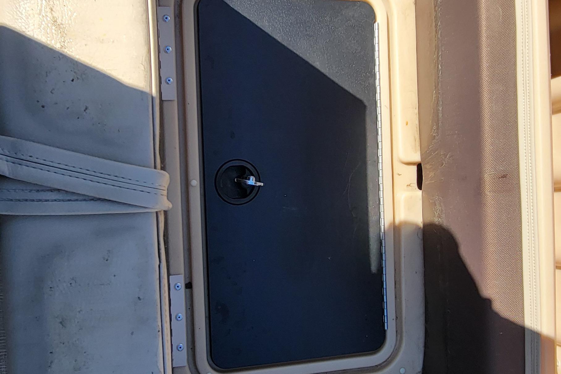 Storage compartment on 2019 Sun Tracker Party Barge 24 DLX boat.