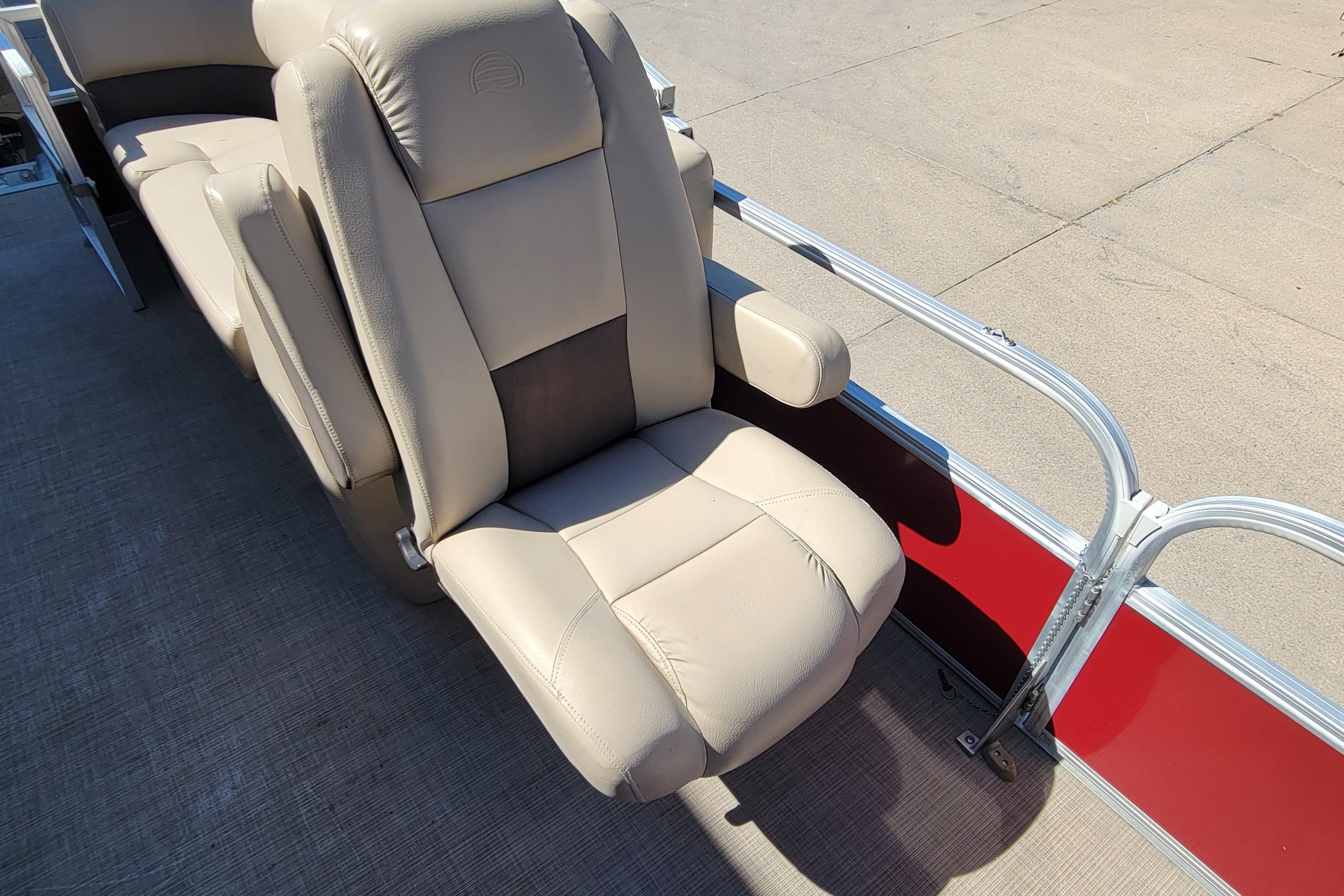 2019 Sun Tracker Party Barge 24 DLX beige seating with armrest on deck.