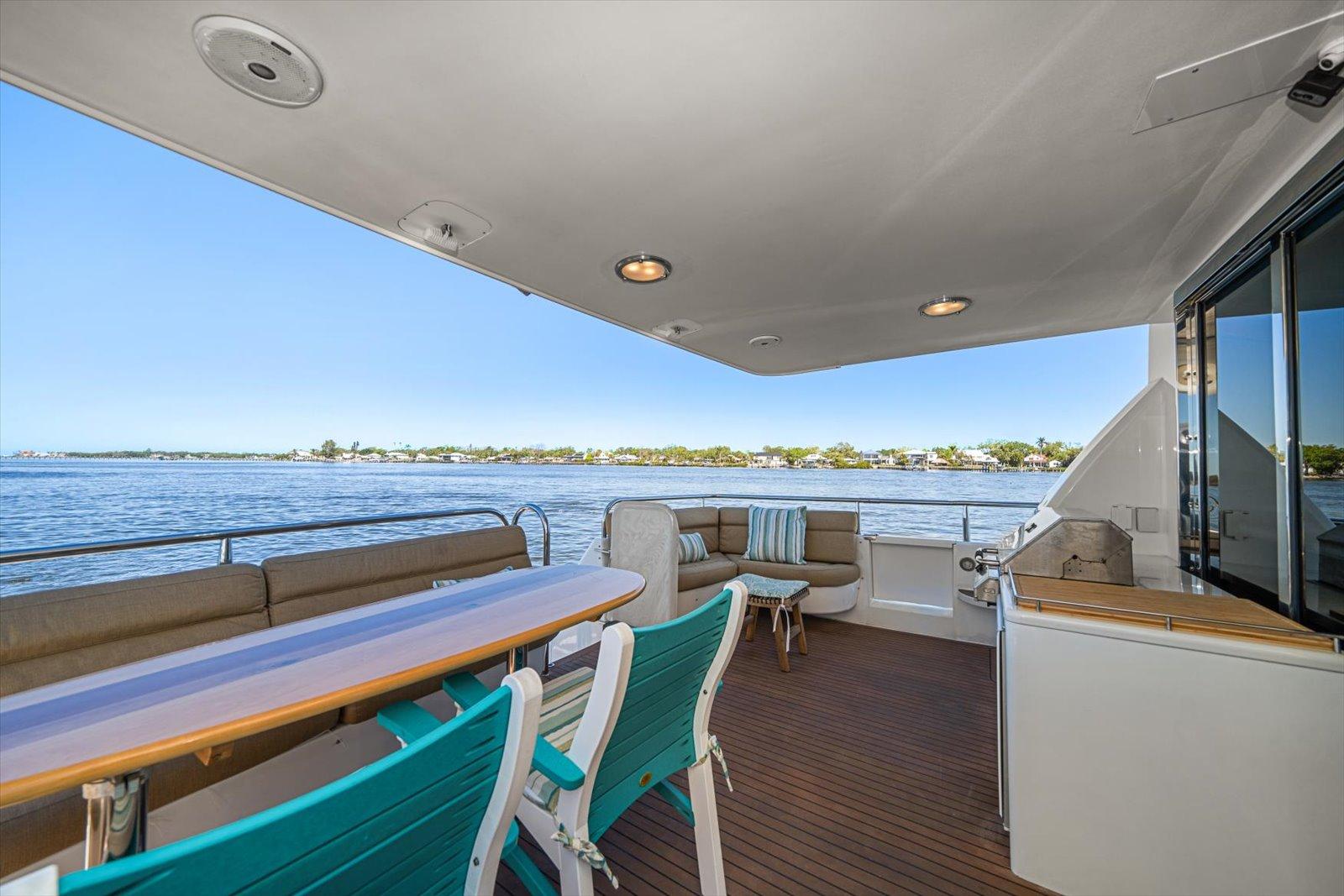 Lazzara-EB 76 1997-Octopi FL-US-Luxurious 1997 Lazzara EB 76 yacht deck with seating, ocean view, and modern amenities.-9736767 | Thumbnail