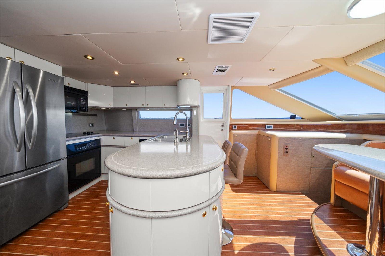 Lazzara-EB 76 1997-Octopi FL-US-Luxurious kitchen interior of 1997 Lazzara EB 76 yacht with modern appliances and wood flooring.-9736767 | Thumbnail