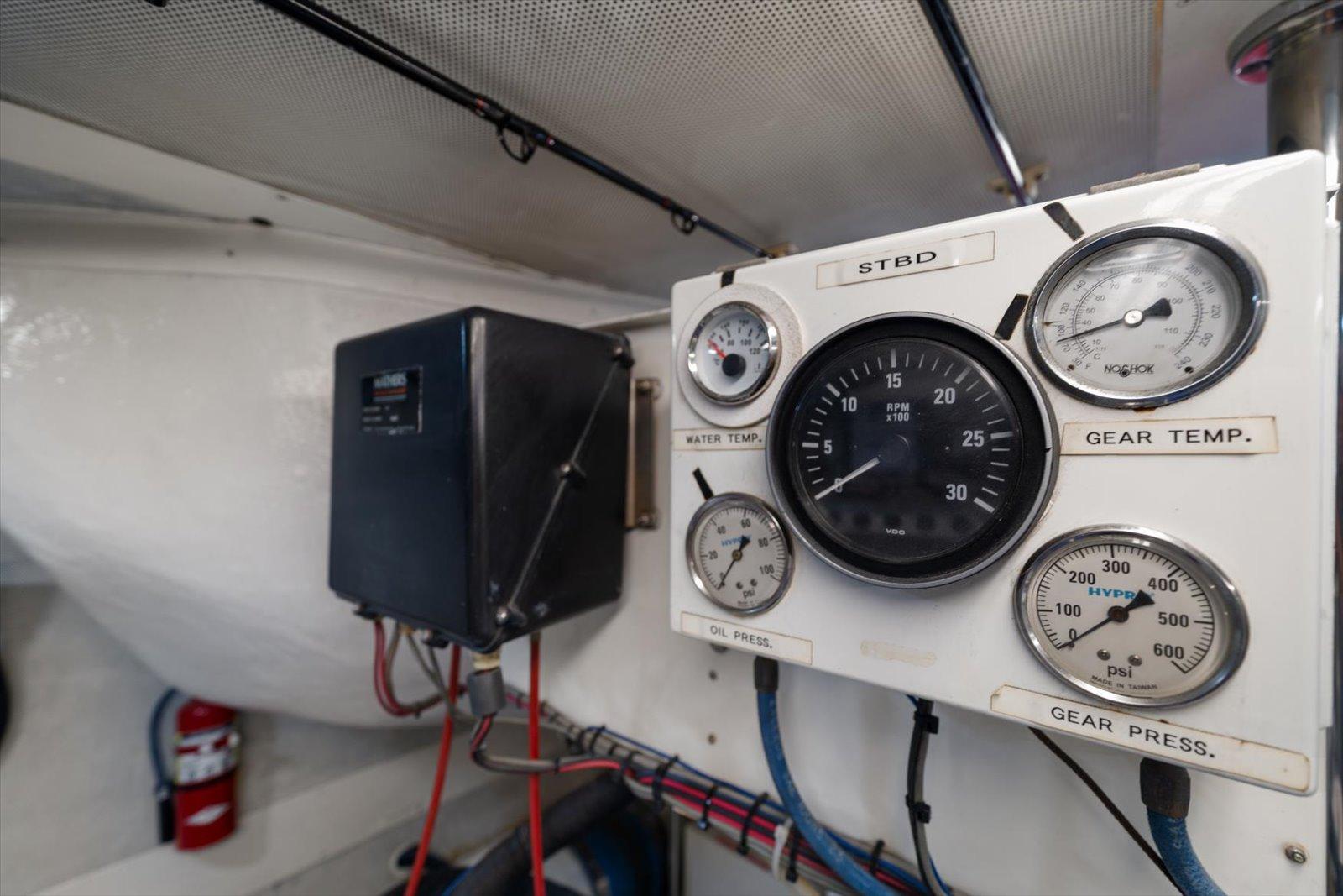 Lazzara-EB 76 1997-Octopi FL-US-Control panel of a 1997 Lazzara EB 76 yacht engine room with gauges and wiring.-9736767 | Thumbnail