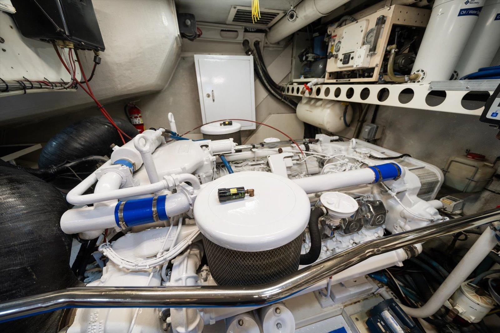 Lazzara-EB 76 1997-Octopi FL-US-Engine room of a 1997 Lazzara EB 76 yacht, showcasing mechanical components and piping.-9736767 | Thumbnail