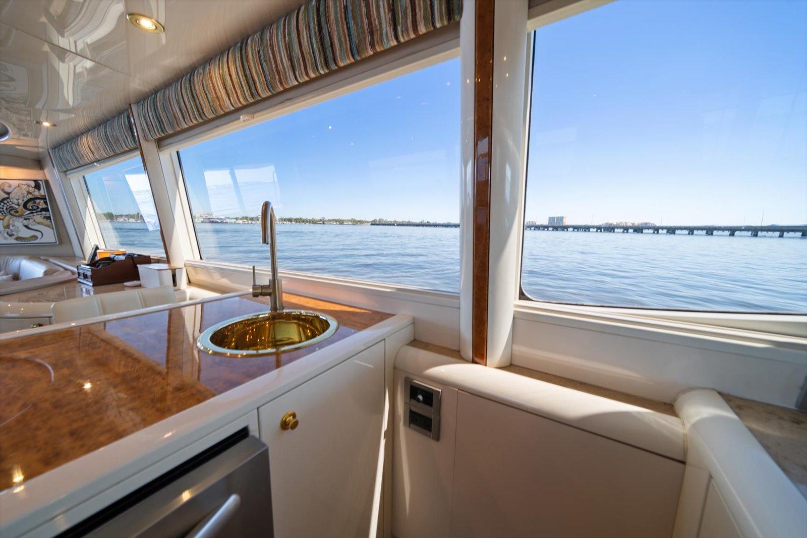 Lazzara-EB 76 1997-Octopi FL-US-Interior view of 1997 Lazzara EB 76 yacht with ocean view through large windows.-9736767 | Thumbnail