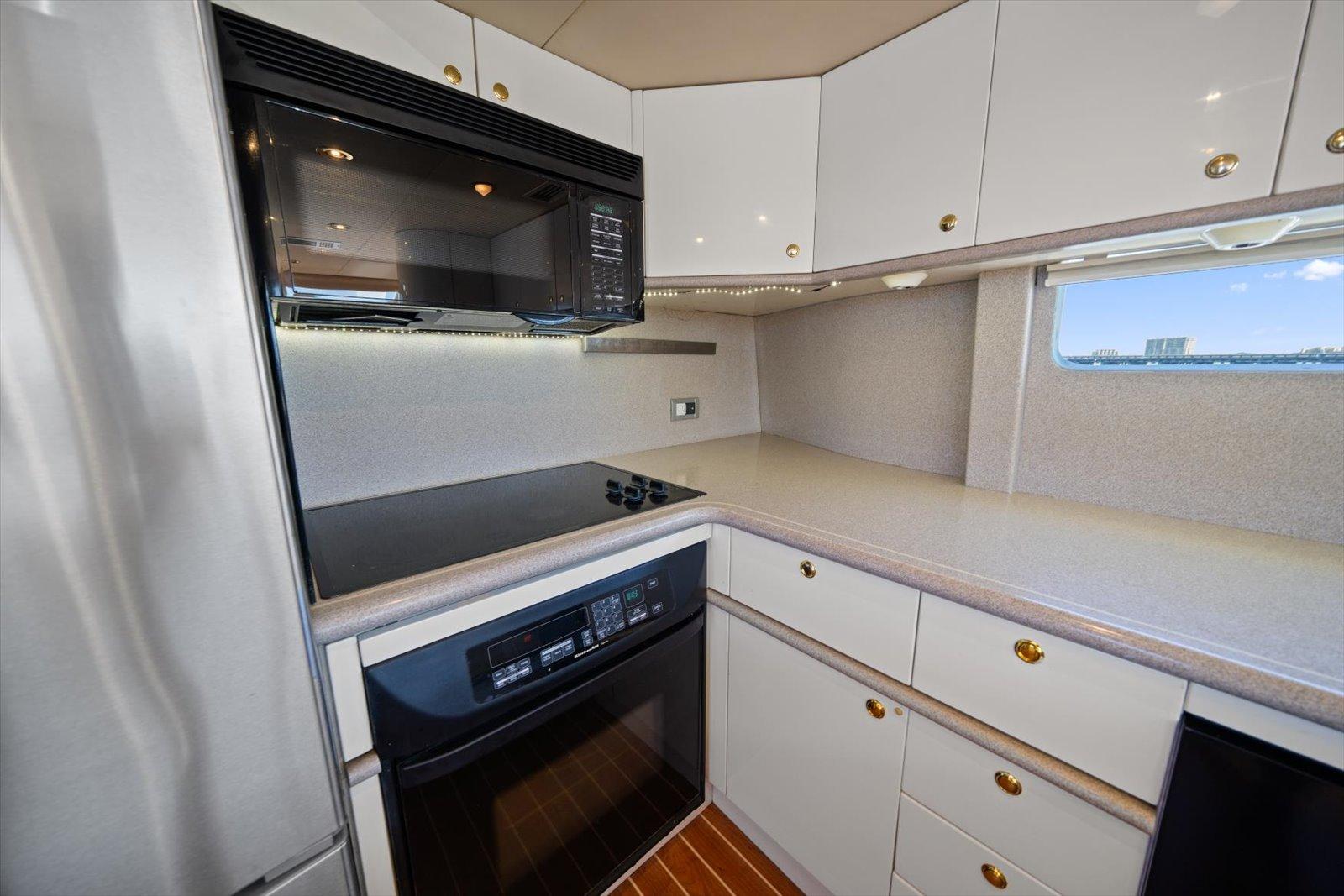 Lazzara-EB 76 1997-Octopi FL-US-Modern kitchen in 1997 Lazzara EB 76 yacht with sleek cabinetry and appliances.-9736767 | Thumbnail