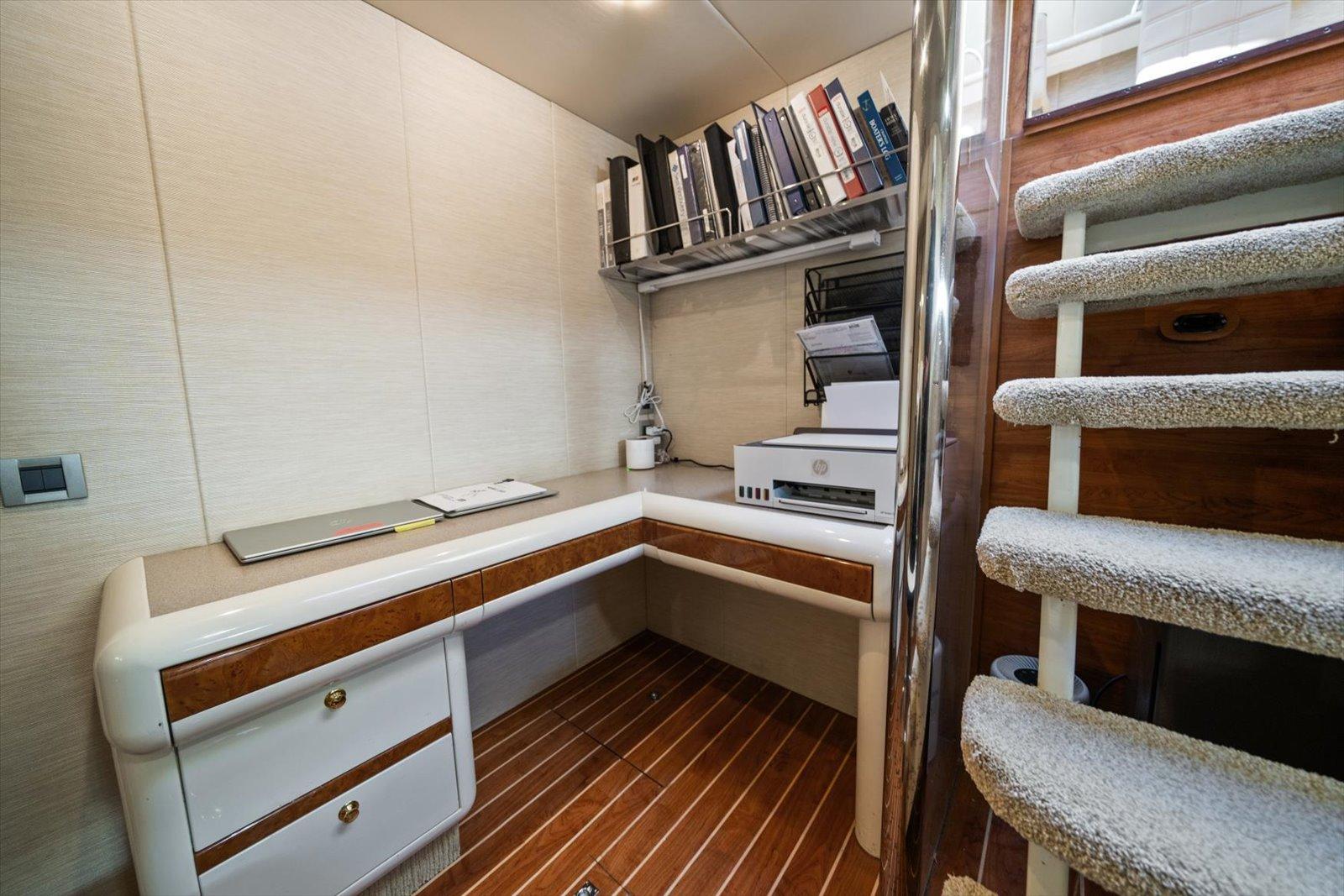Lazzara-EB 76 1997-Octopi FL-US-Office space on 1997 Lazzara EB 76 yacht with desk, shelves, and stairs.-9736767 | Thumbnail