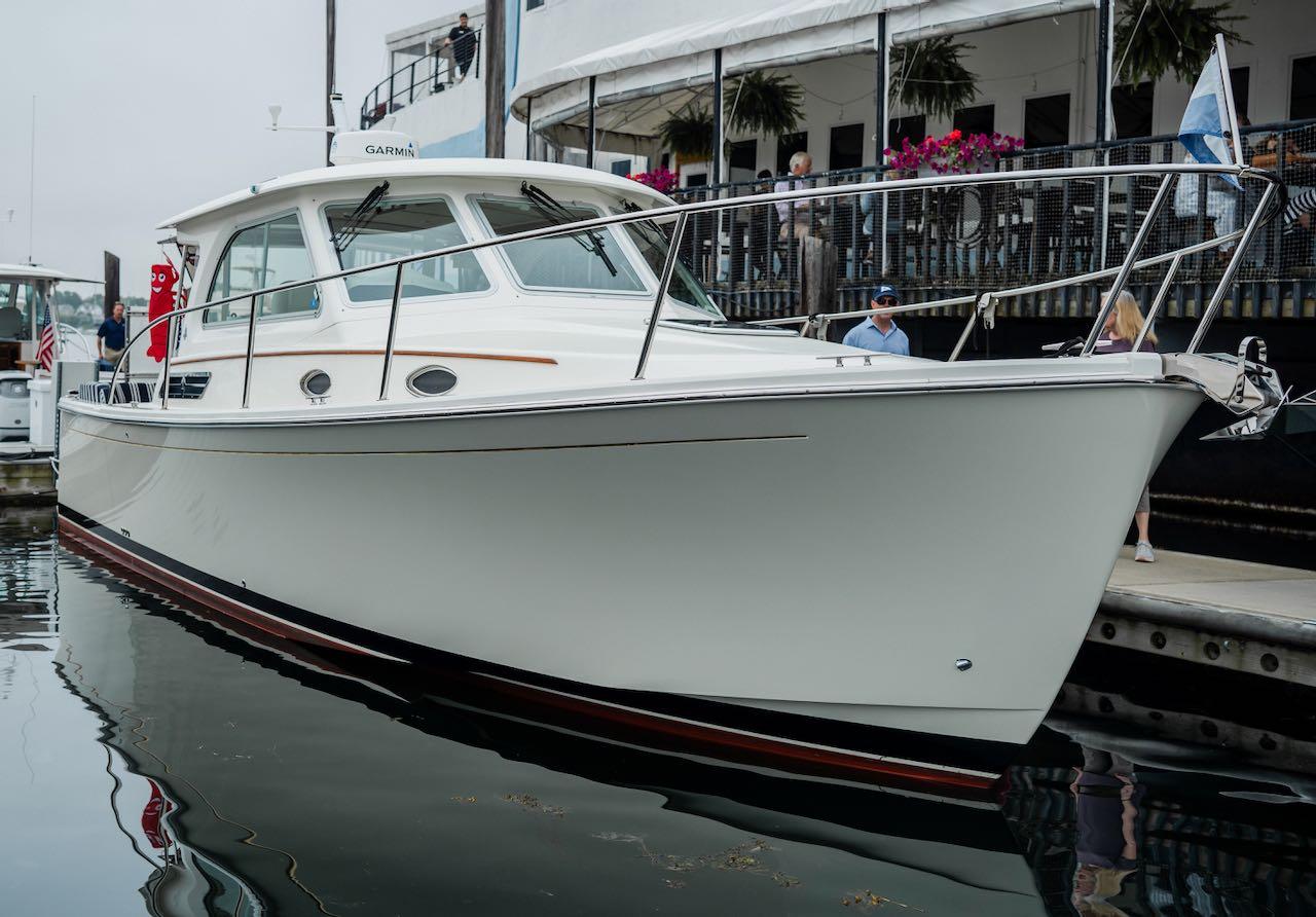 2017 Back Cove 32 boat docked at marina, showcasing sleek design and modern features.
