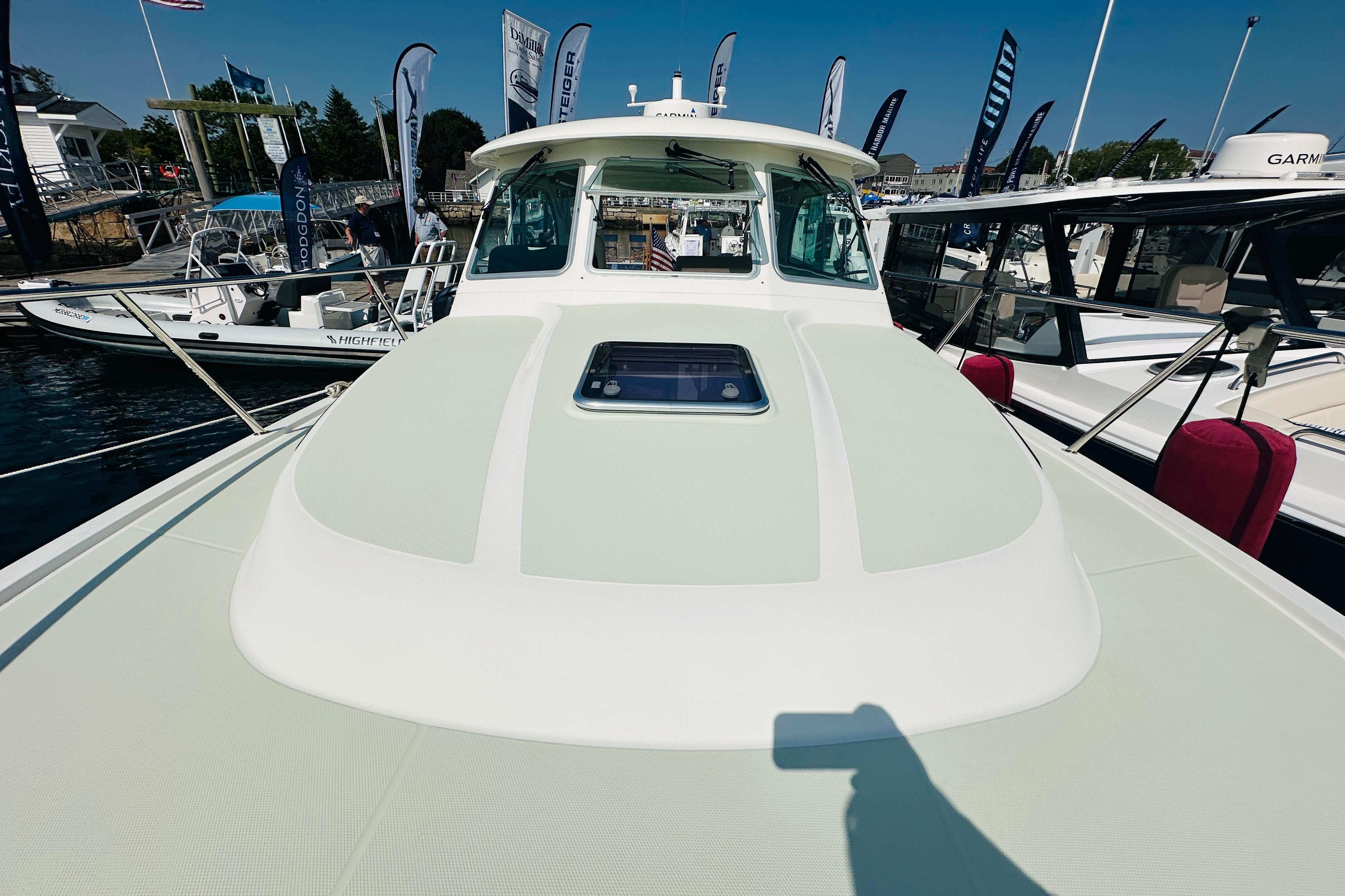 2017 Back Cove 32 yacht on display at a boat show, surrounded by other vessels.