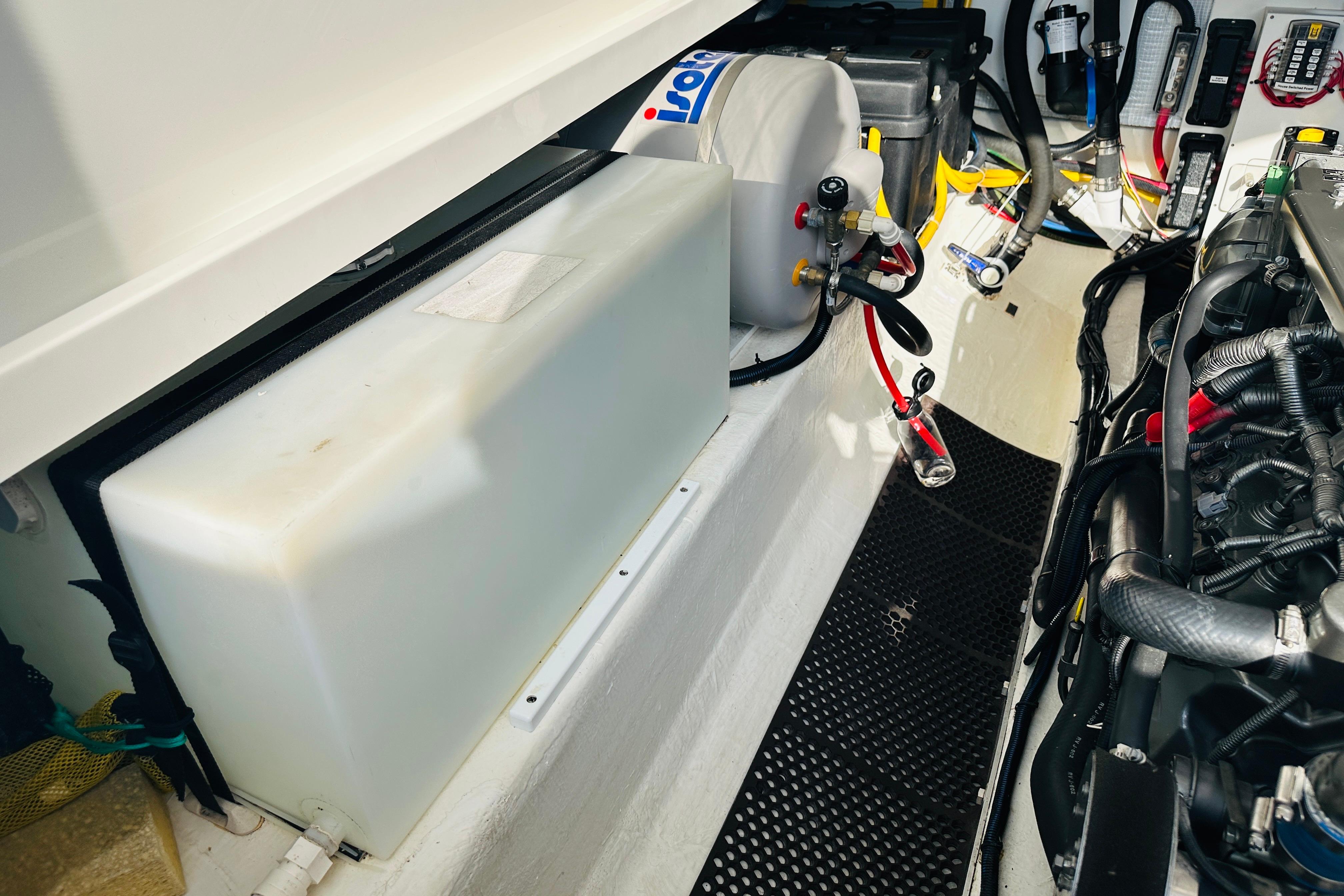 Engine compartment of a 2017 Back Cove 32 boat, showcasing mechanical components and wiring.