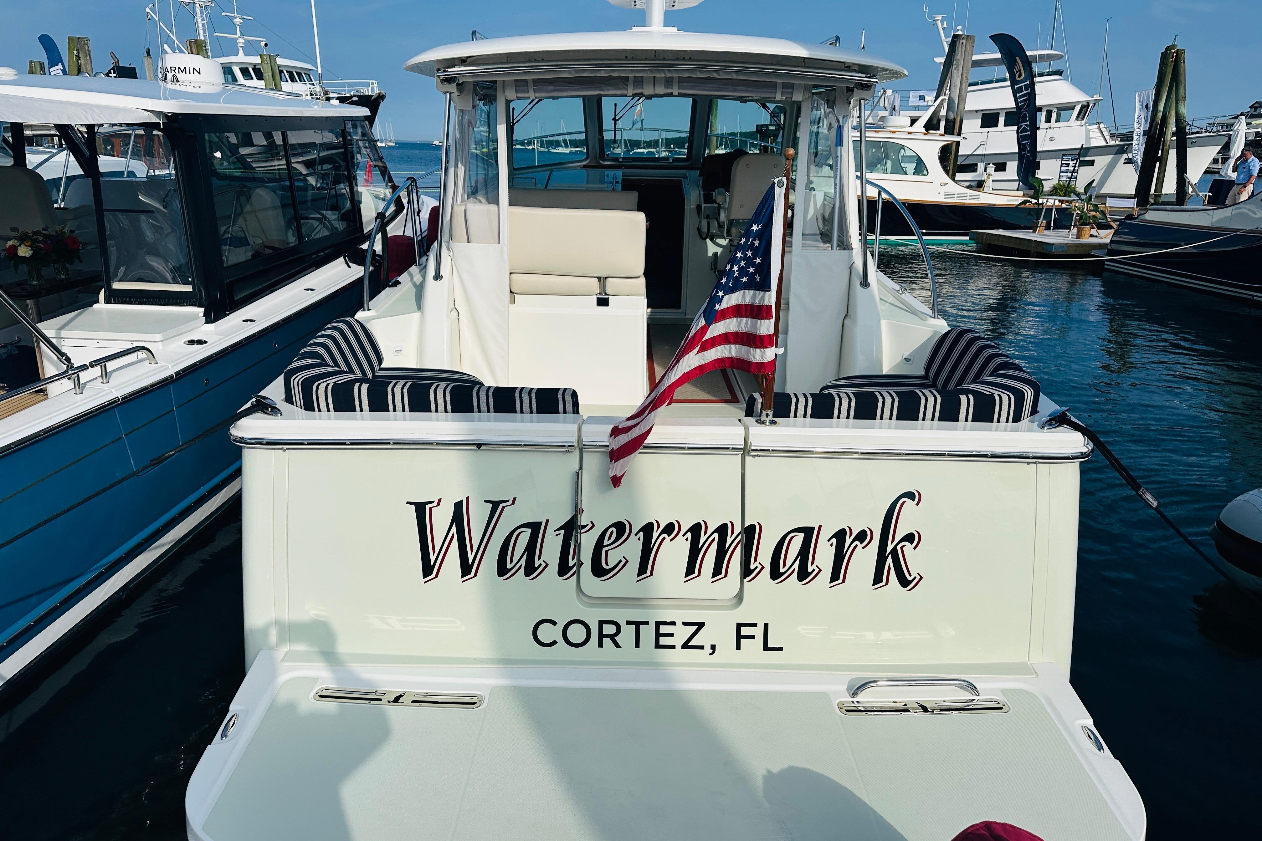 Back Cove 32 boat, 2017 model, docked with American flag, named u0022Watermark,u0022 Cortez, FL.