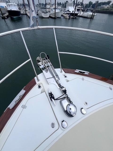 Bow of 2021 Sabre 45 Salon Express yacht docked in marina.