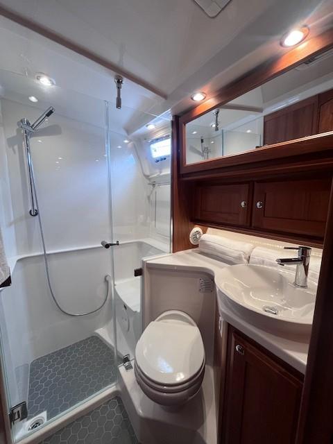 Luxurious bathroom in 2021 Sabre 45 Salon Express yacht with modern fixtures and elegant design.