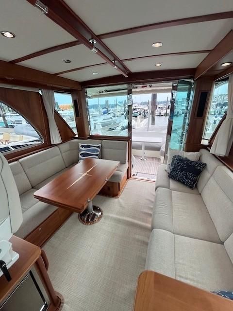 2021 Sabre 45 Salon Express interior with elegant seating and wooden accents.