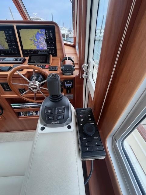 2021 Sabre 45 Salon Express helm with joystick control and navigation screens.