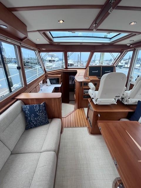 2021 Sabre 45 Salon Express interior with plush seating and modern helm.