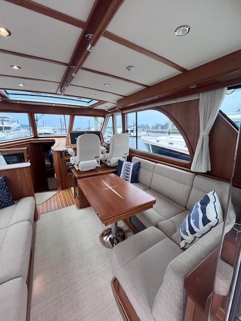 2021 Sabre 45 Salon Express interior with elegant seating and wooden accents.