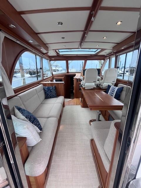 2021 Sabre 45 Salon Express interior with elegant seating and wooden accents.