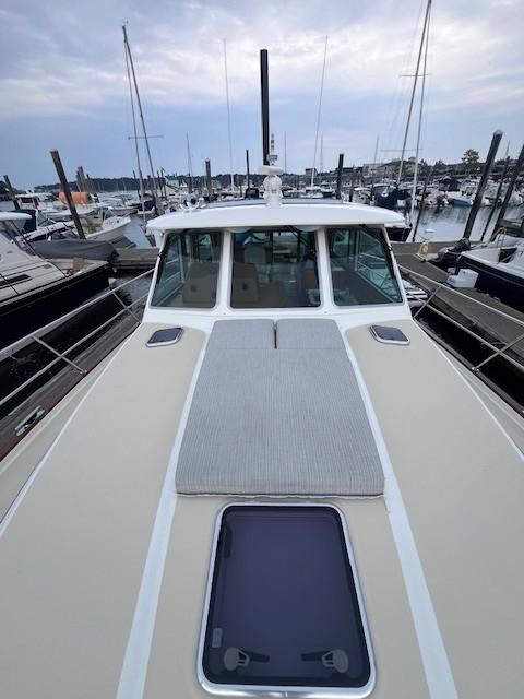 2021 Sabre 45 Salon Express yacht docked at marina, showcasing sleek deck design.