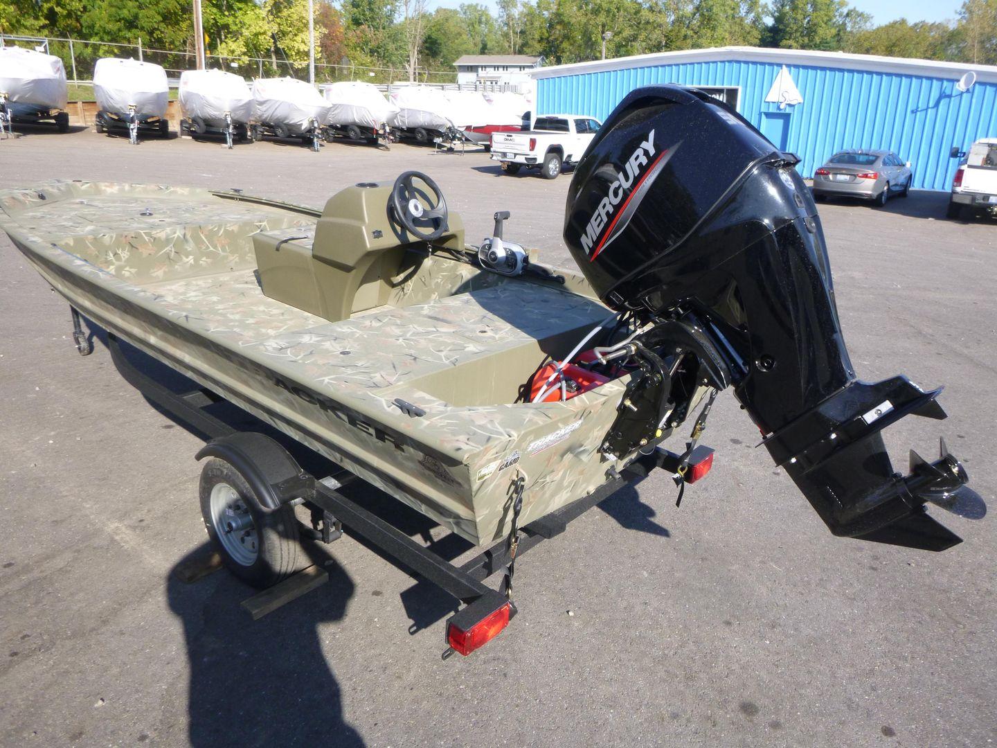 2024 Tracker Grizzly 1648 SC boat with Mercury outboard motor on trailer.