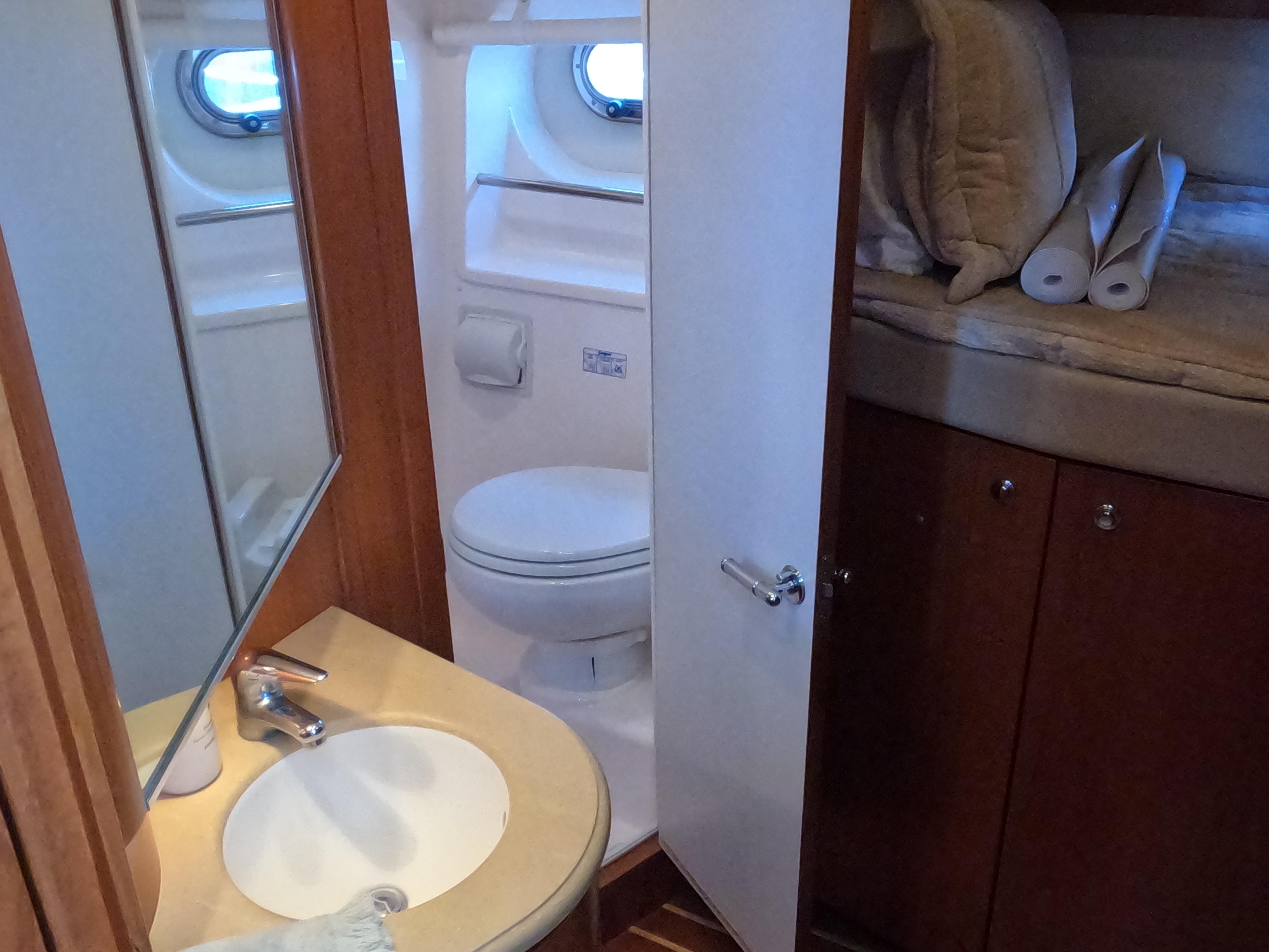 Tiara Yachts-4400 Sovran 2004-CC Rider FL-US-2004 Tiara Yachts 4400 Sovran bathroom with sink, toilet, and storage.-9631623 | Thumbnail