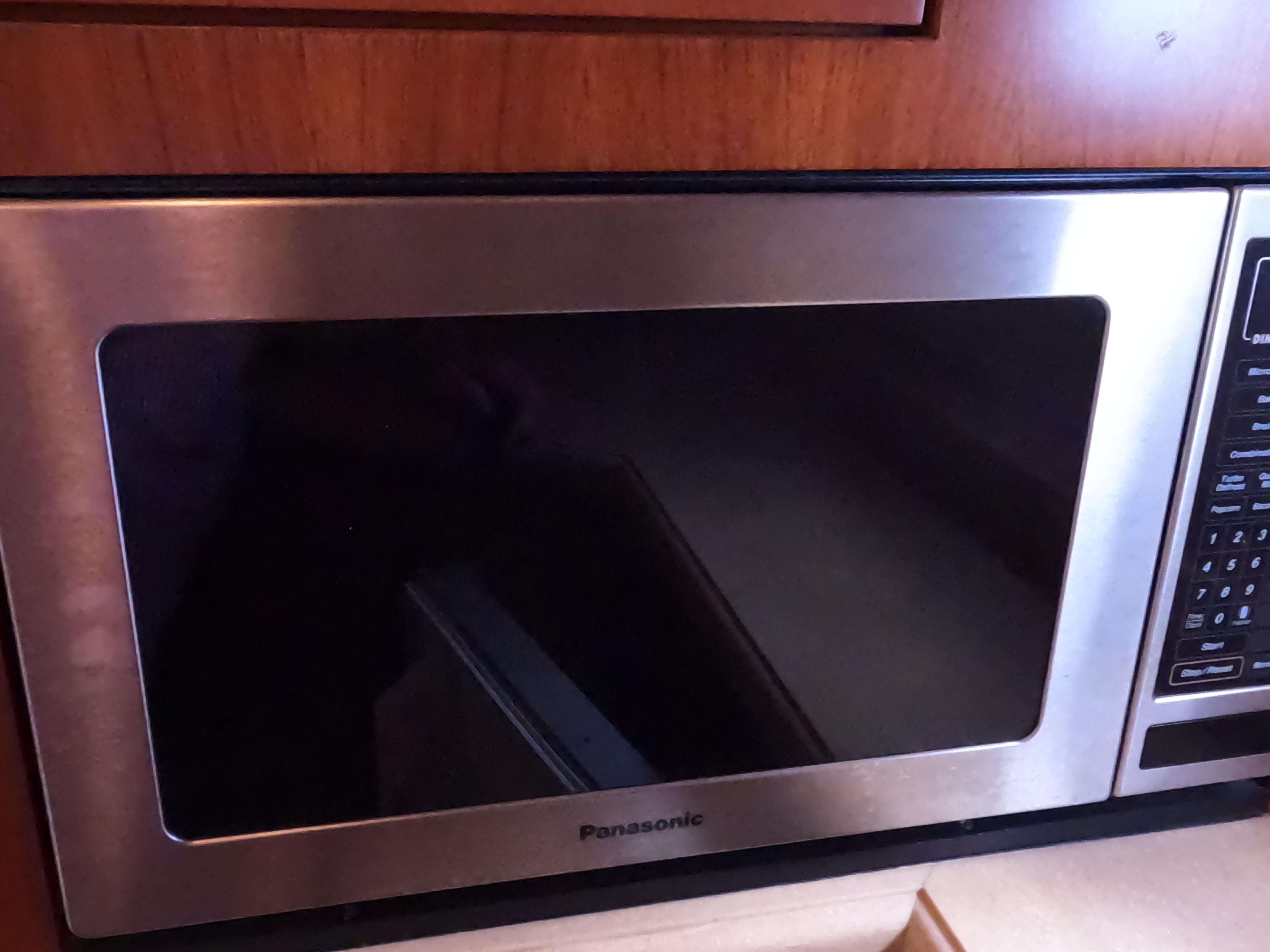 Tiara Yachts-4400 Sovran 2004-CC Rider FL-US-Panasonic microwave in 2004 Tiara Yachts 4400 Sovran kitchen area.-9631623 | Thumbnail