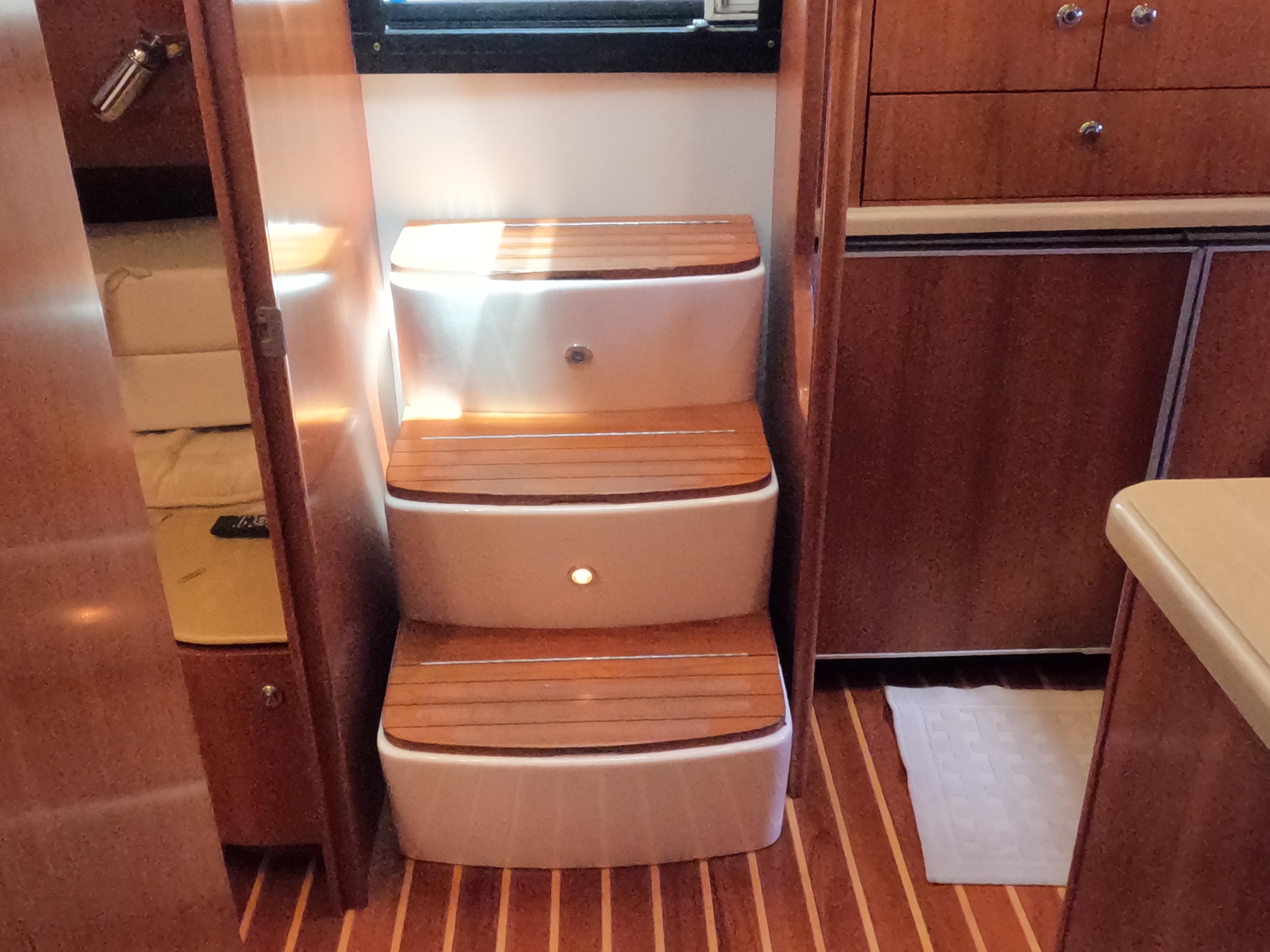 Tiara Yachts-4400 Sovran 2004-CC Rider FL-US-Interior stairs of 2004 Tiara Yachts 4400 Sovran with wooden steps and modern design.-9631623 | Thumbnail