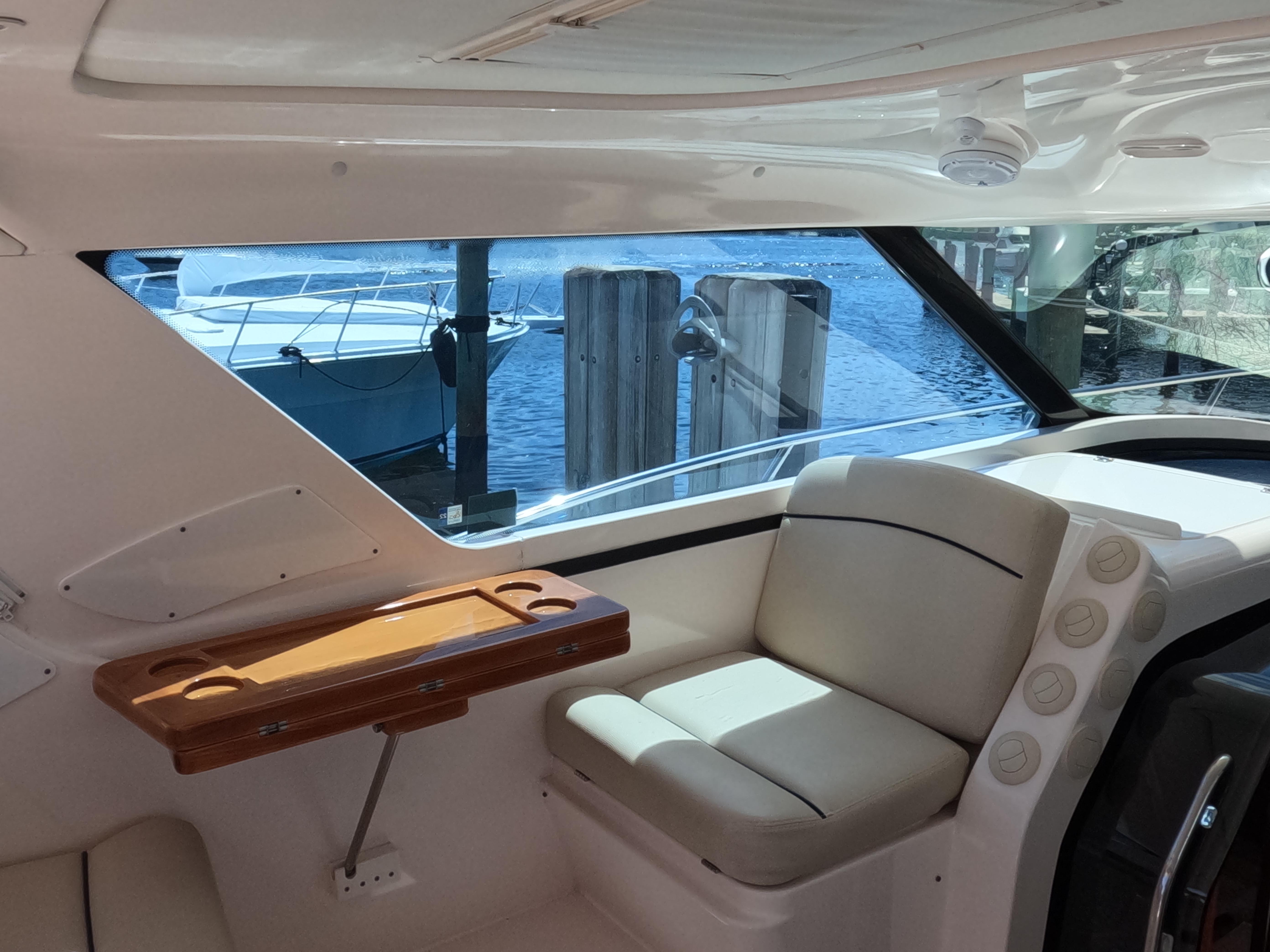Tiara Yachts-4400 Sovran 2004-CC Rider FL-US-Interior of 2004 Tiara Yachts 4400 Sovran with seating and window view of marina.-9631623 | Thumbnail