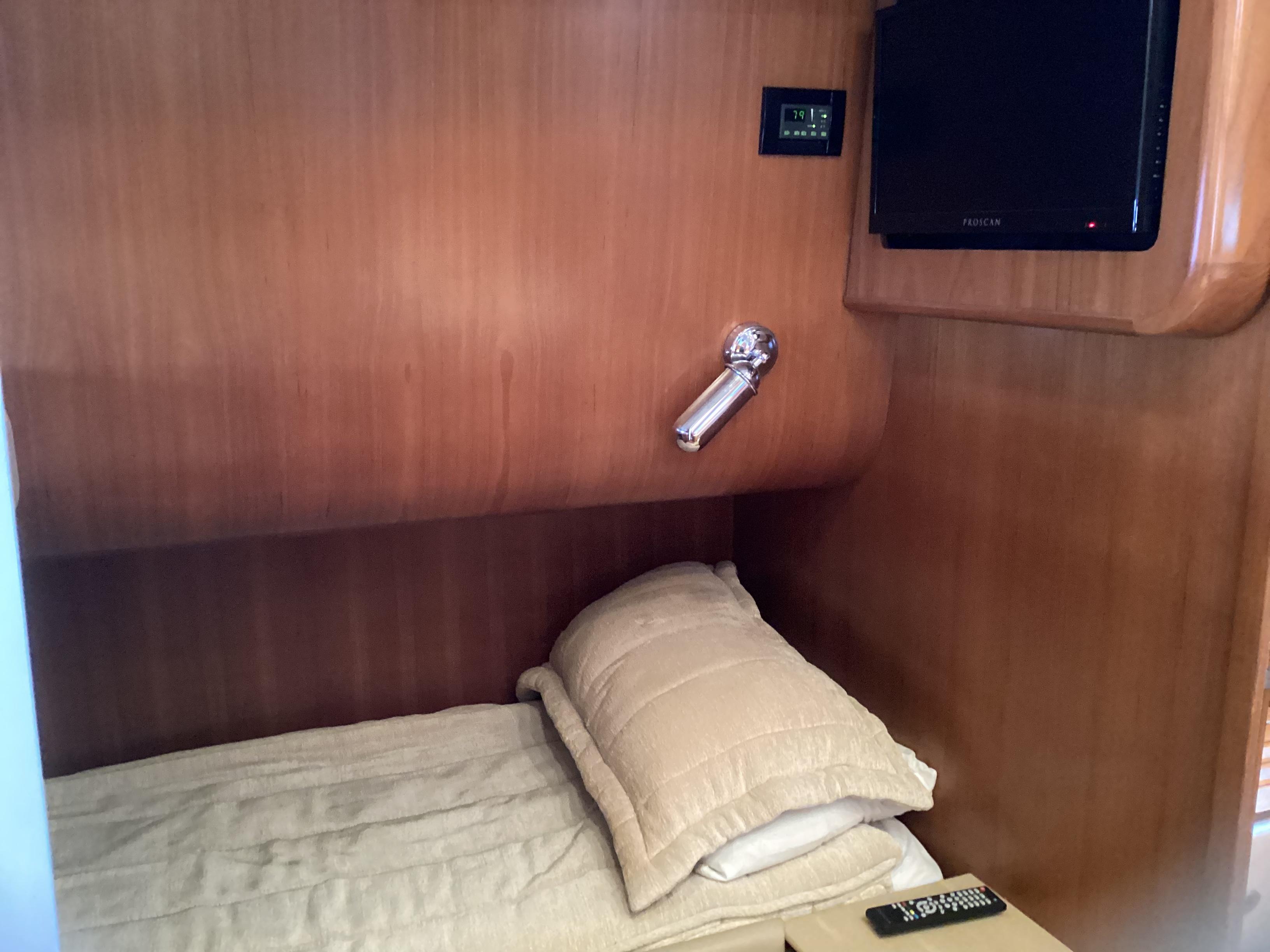 Tiara Yachts-4400 Sovran 2004-CC Rider FL-US-Cozy cabin interior of 2004 Tiara Yachts 4400 Sovran with bed and TV.-9631623 | Thumbnail