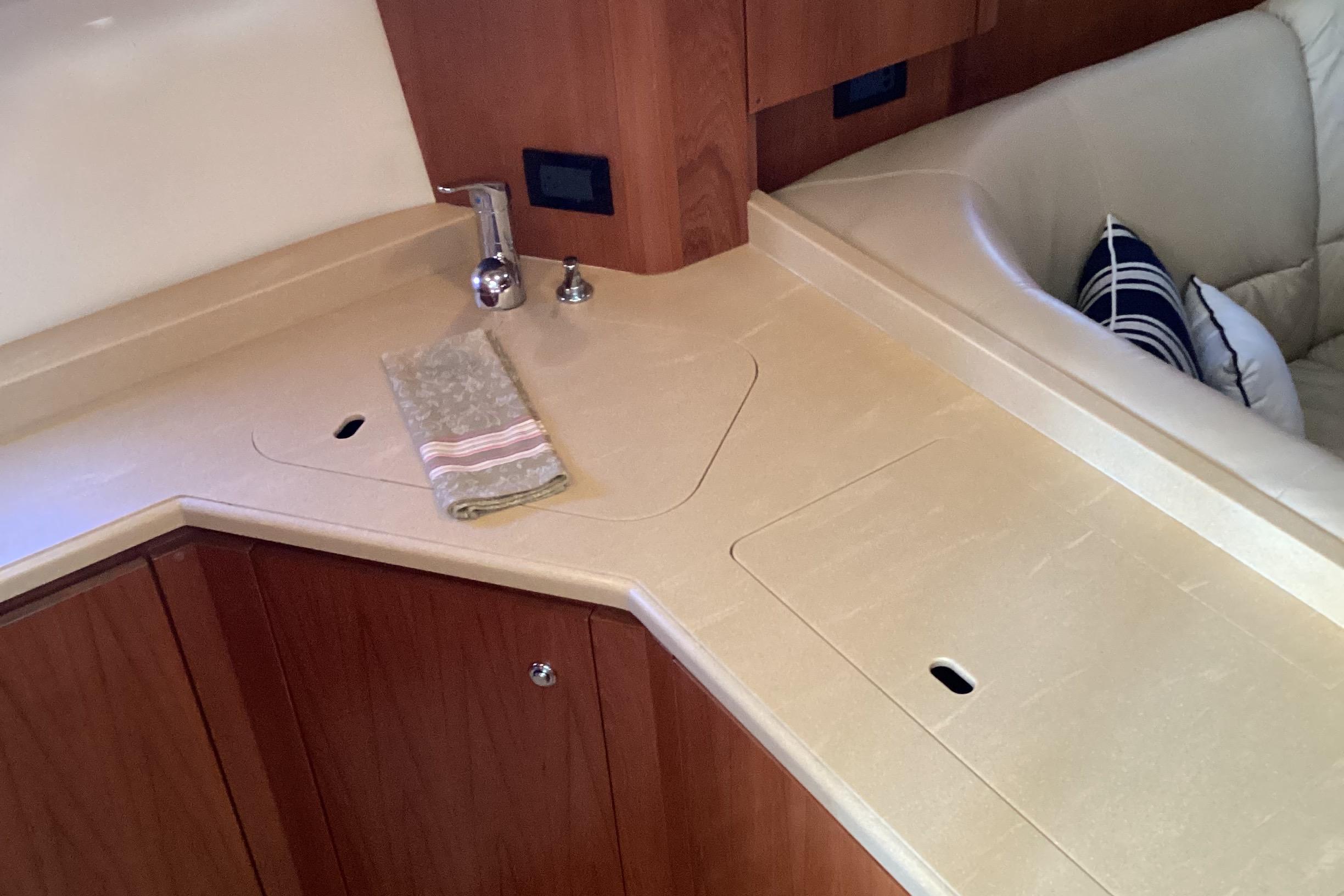 Tiara Yachts-4400 Sovran 2004-CC Rider FL-US-2004 Tiara Yachts 4400 Sovran interior with sleek kitchen counter and sink.-9631623 | Thumbnail