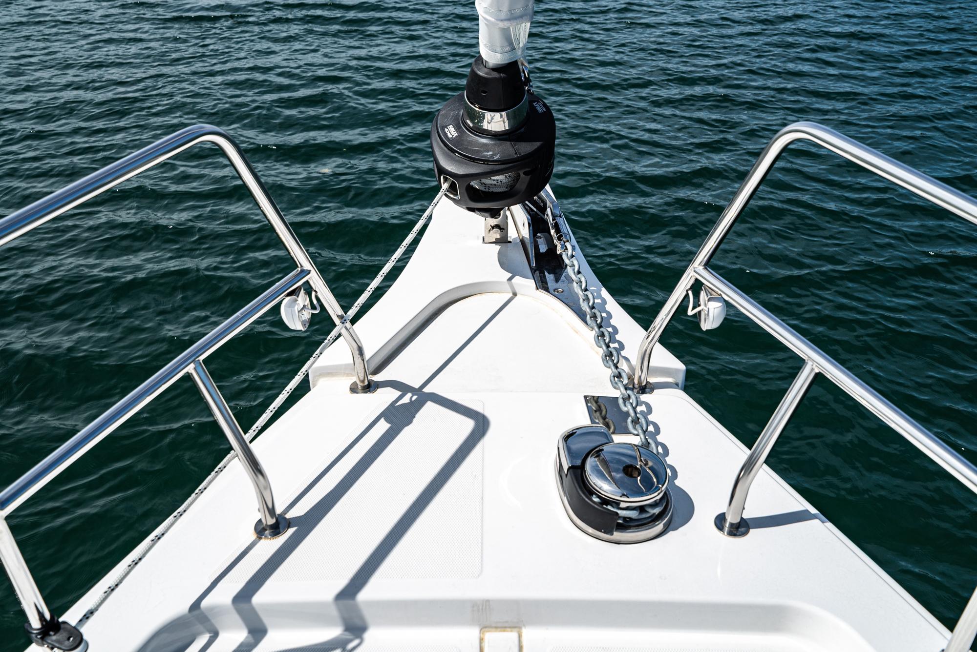 Bavaria-C50 2024-This could be yours CA-US-Bow of 2024 Bavaria C50 yacht with anchor chain over calm water.-9654457 | Thumbnail