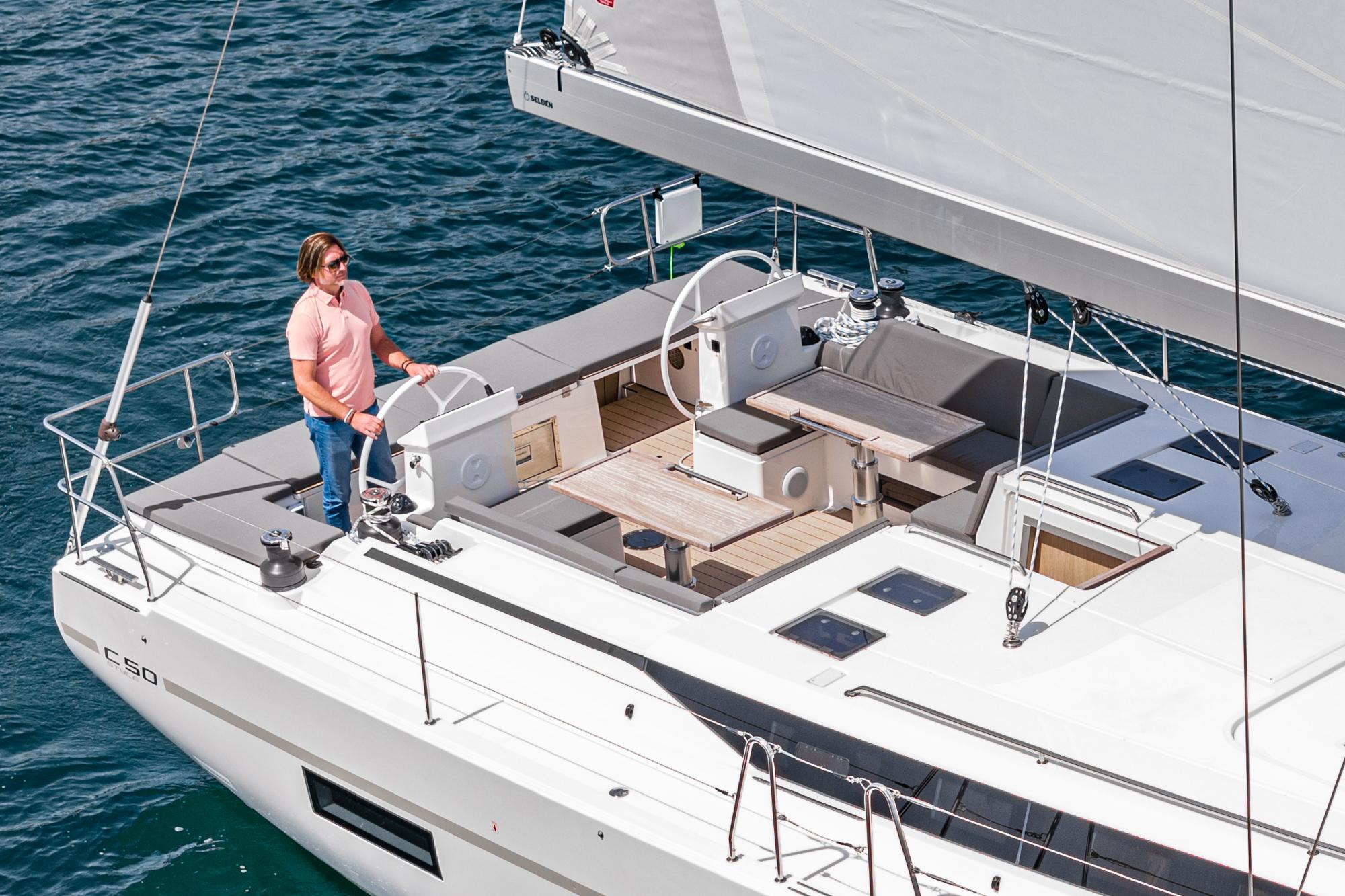 Bavaria-C50 2024-This could be yours CA-US-2024 Bavaria C50 yacht sailing with person on deck, featuring modern design and spacious layout.-9654457 | Thumbnail