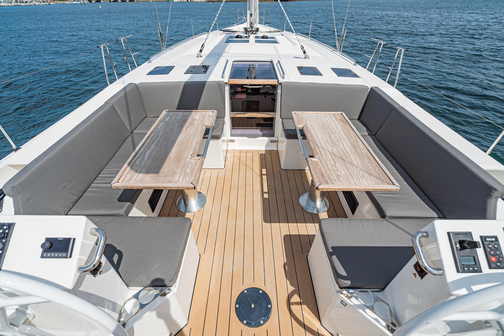 Bavaria-C50 2024-This could be yours CA-US-Spacious deck of 2024 Bavaria C50 yacht with seating and tables, overlooking the ocean.-9654457 | Thumbnail