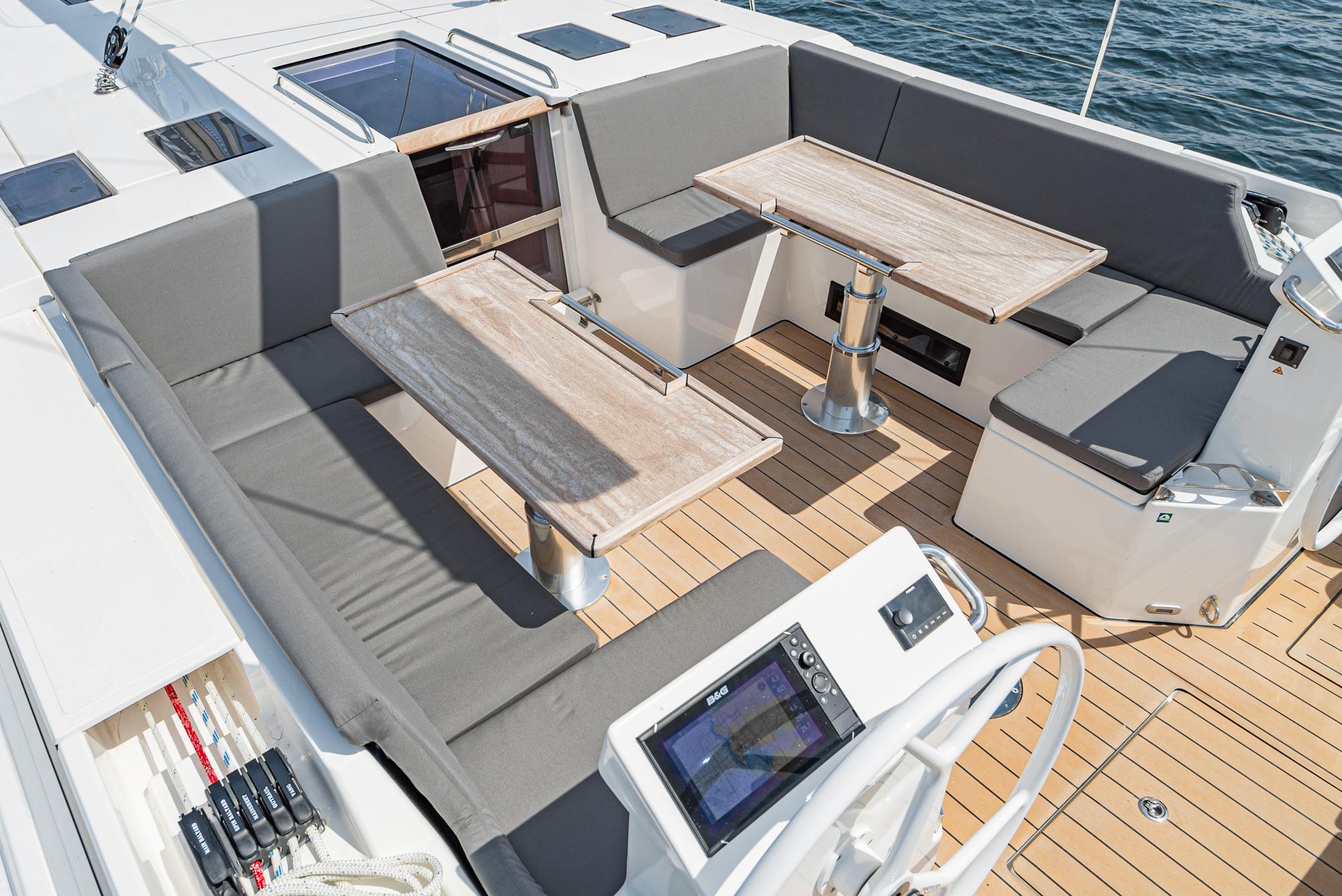 Bavaria-C50 2024-This could be yours CA-US-Spacious deck of 2024 Bavaria C50 yacht with seating and navigation controls.-9654457 | Thumbnail