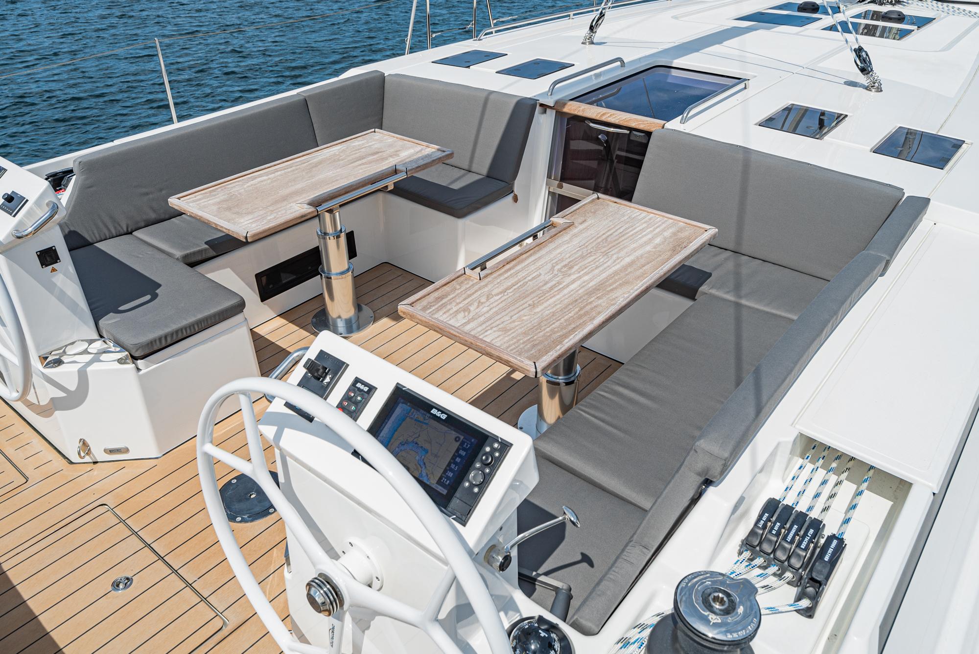 Bavaria-C50 2024-This could be yours CA-US-2024 Bavaria C50 yacht deck with seating, tables, and navigation controls.-9654457 | Thumbnail