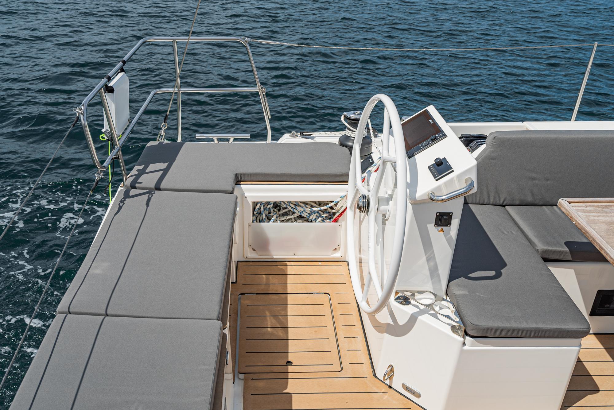 Bavaria-C50 2024-This could be yours CA-US-2024 Bavaria C50 yacht cockpit with steering wheel and seating, overlooking the ocean.-9654457 | Thumbnail