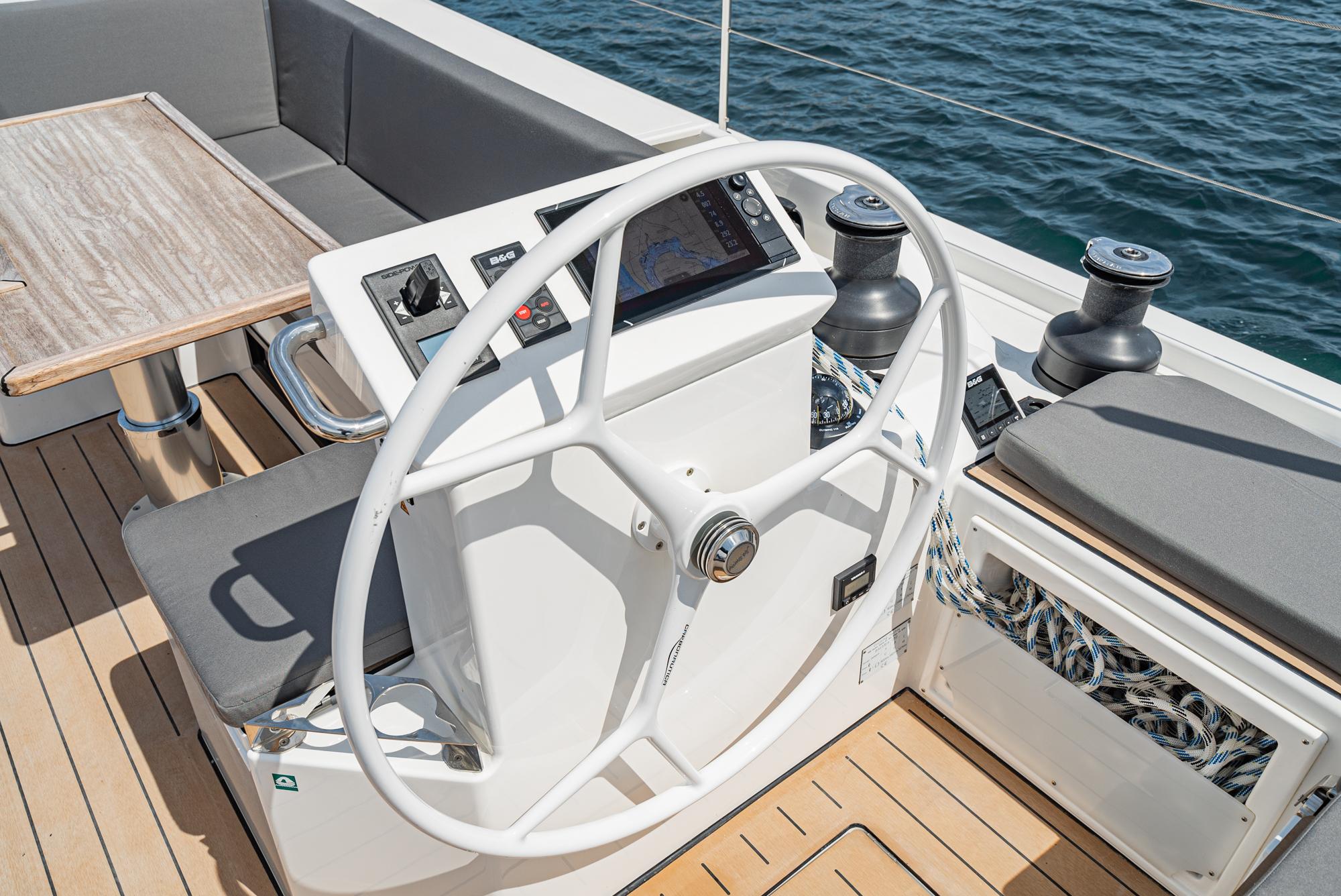 Bavaria-C50 2024-This could be yours CA-US-2024 Bavaria C50 yacht helm with modern navigation system and seating, on open water.-9654457 | Thumbnail