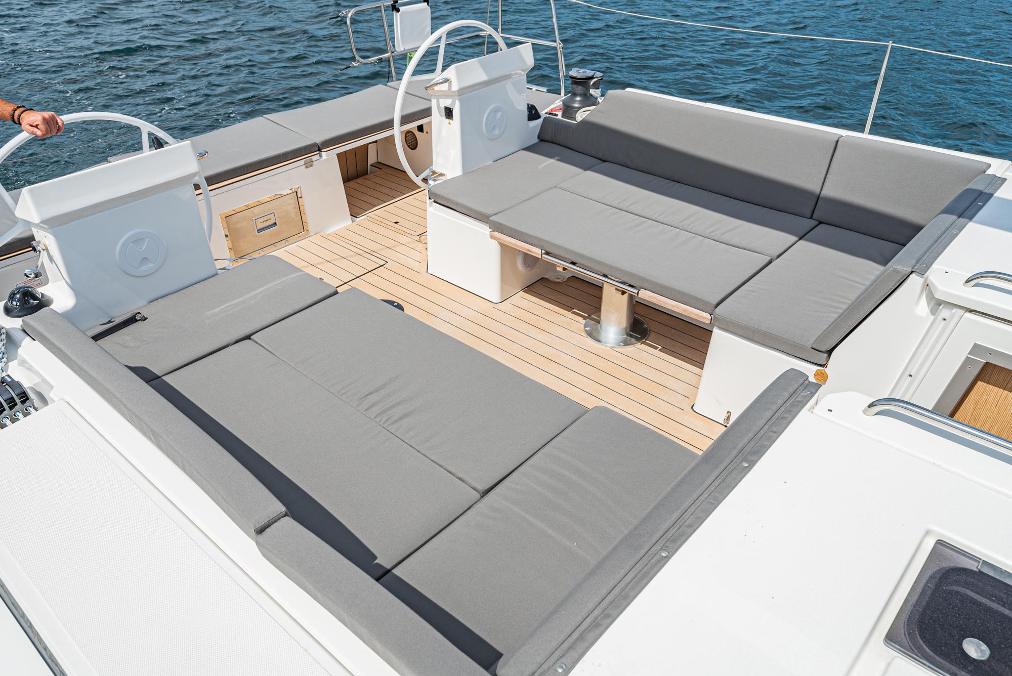 Bavaria-C50 2024-This could be yours CA-US-2024 Bavaria C50 yacht deck with gray seating and wooden flooring.-9654457 | Thumbnail