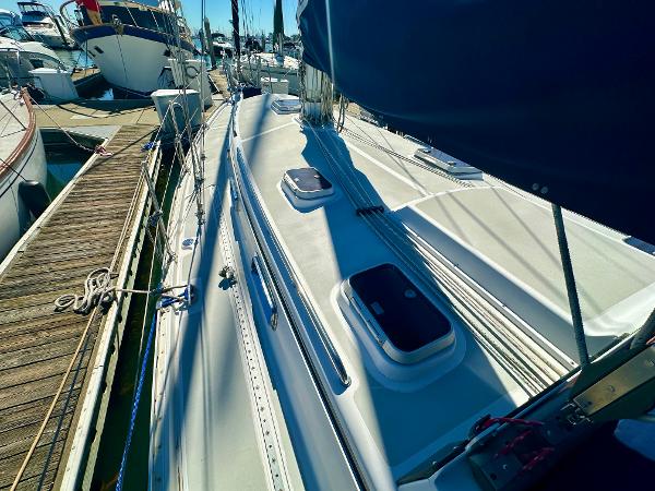Sailboat docked at marina, Valiant 39, 1996 model, sunny day.