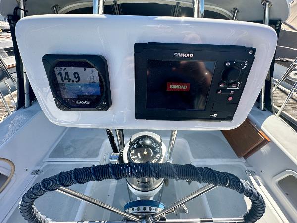 Steering console of a 1996 Valiant 39 sailboat with navigation instruments.