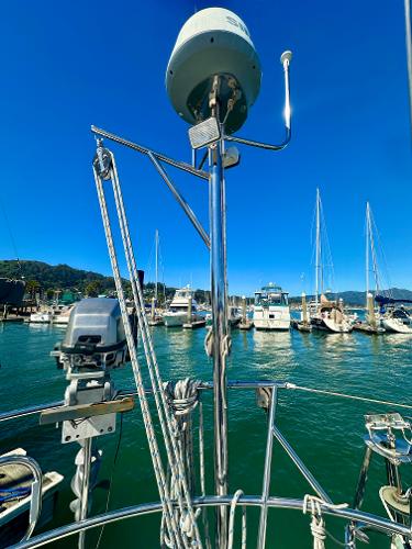 Sailboat Valiant 39, 1996 model, docked in marina with clear blue sky.