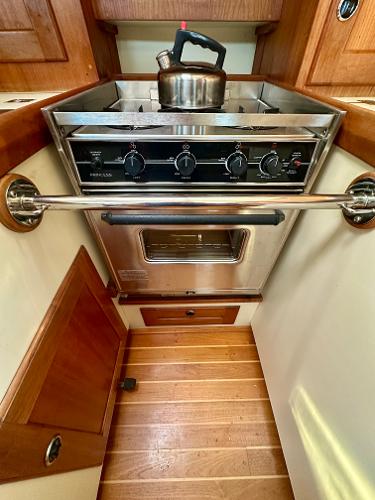 1996 Valiant 39 yacht kitchen with stove, oven, and kettle.
