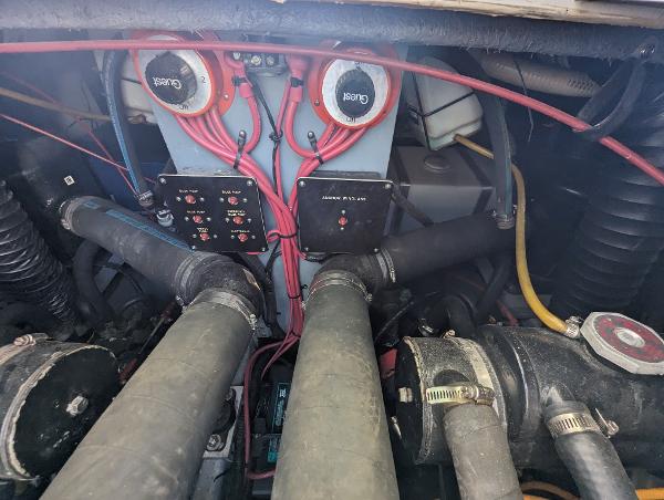 Engine compartment of a 1992 Sea Ray 330 Express Cruiser with visible wiring and components.