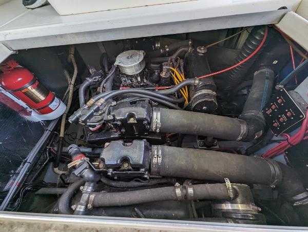 Engine compartment of a 1992 Sea Ray 330 Express Cruiser with visible fire extinguisher.