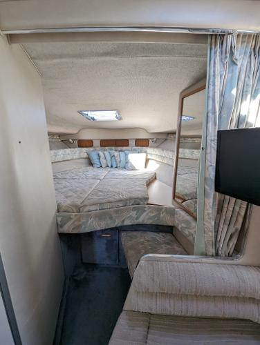 Interior of 1992 Sea Ray 330 Express Cruiser with cozy sleeping area and modern amenities.