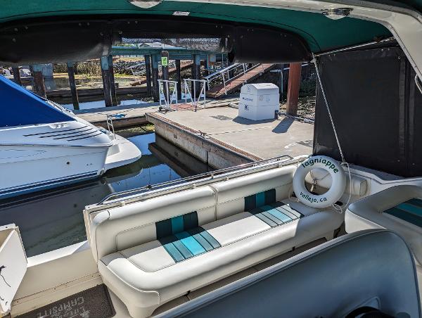 1992 Sea Ray 330 Express Cruiser at dock, featuring spacious seating and marina view.