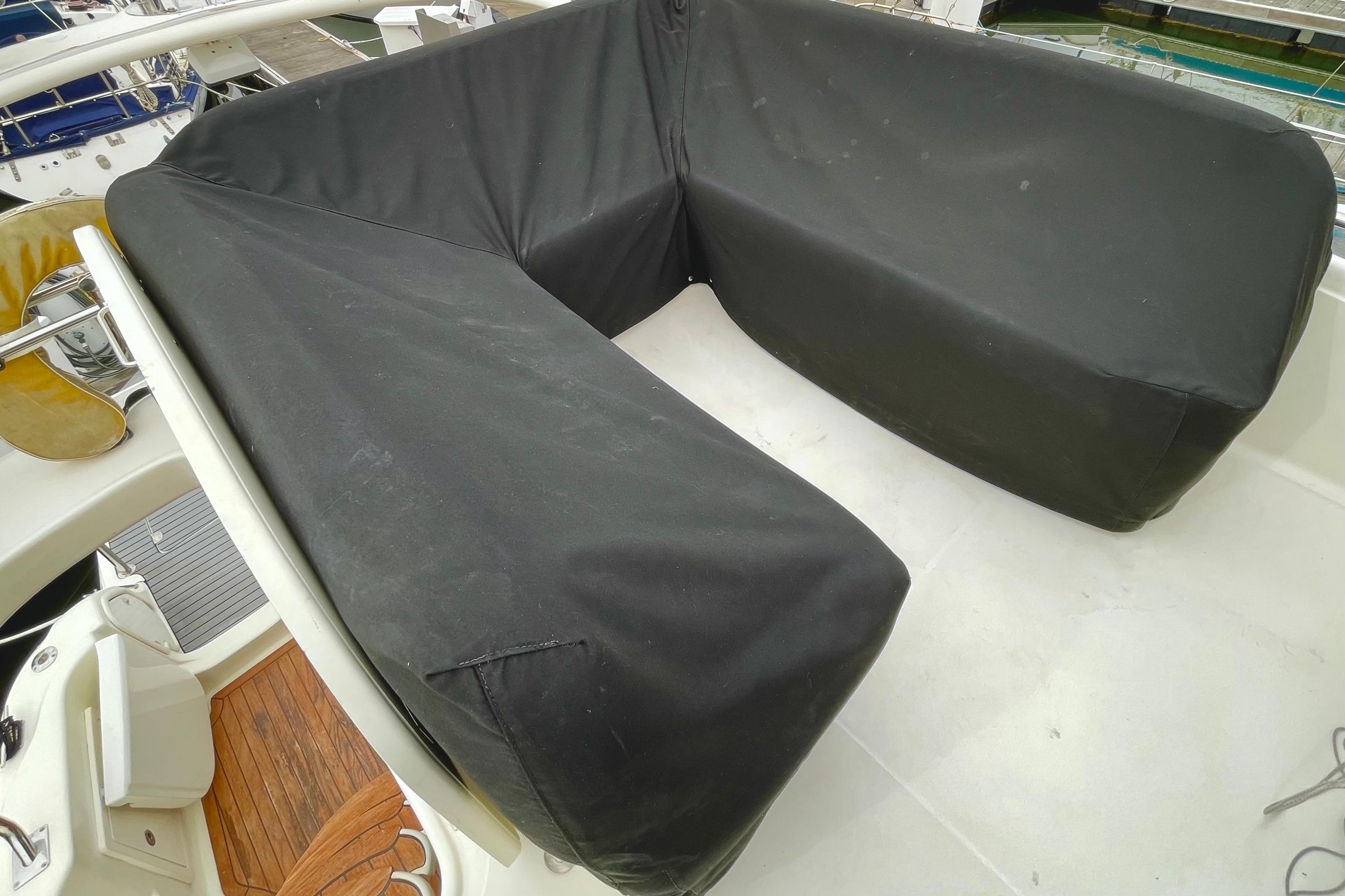 Covered seating area on 2003 Cranchi Atlantique 40 yacht deck.