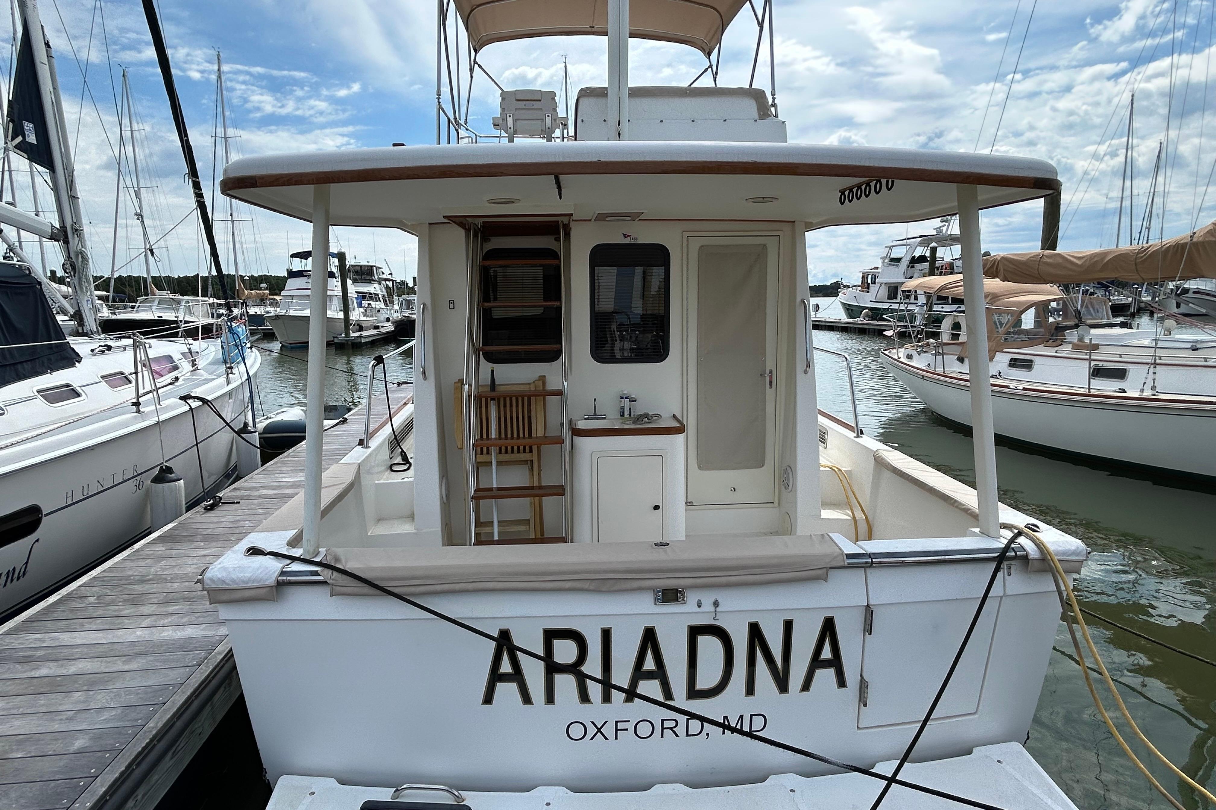 2004 Sabre 36 FB boat named u0022Ariadnau0022 docked at a marina in Oxford, MD.