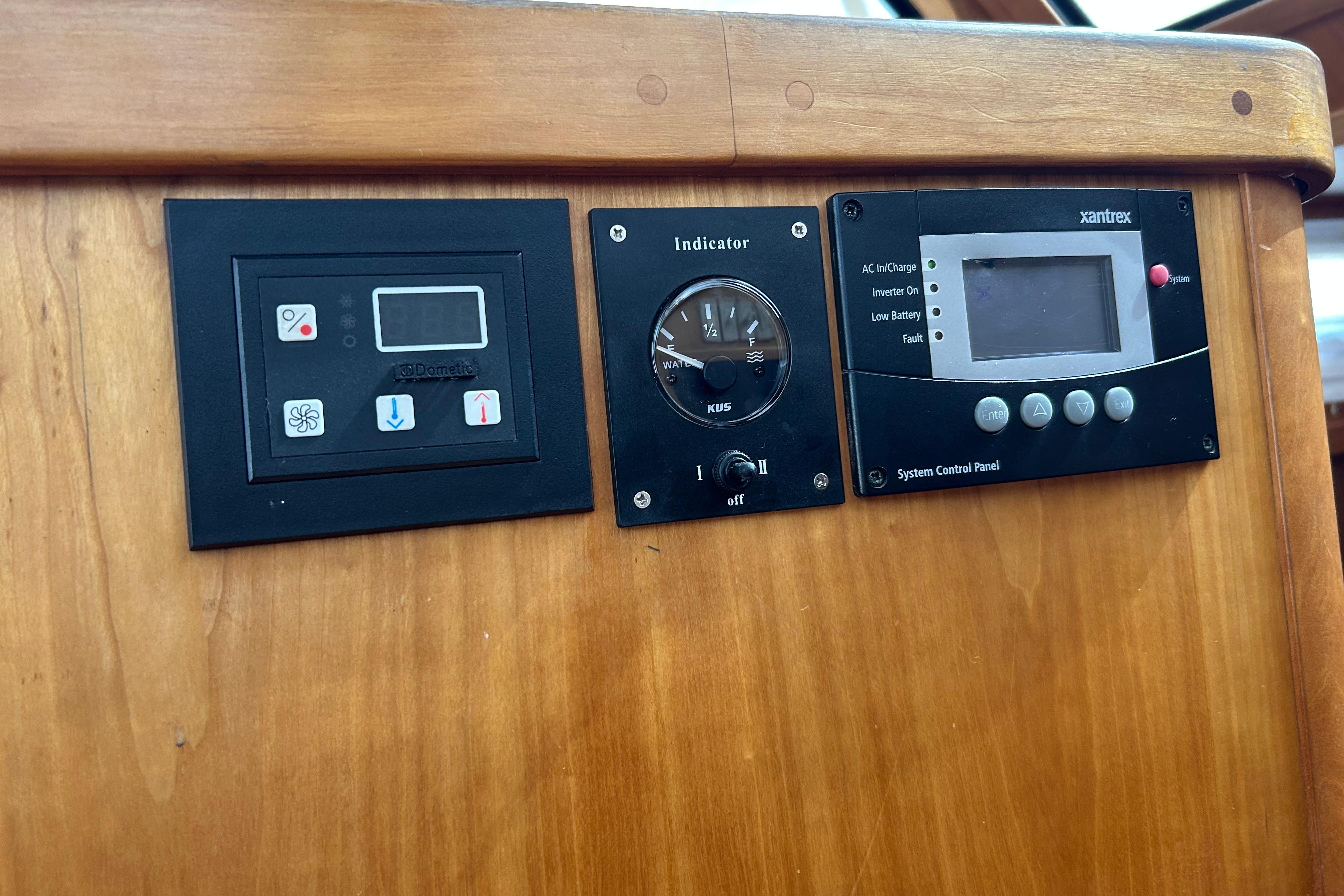 Control panels on a 2004 Sabre 36 FB boat dashboard.